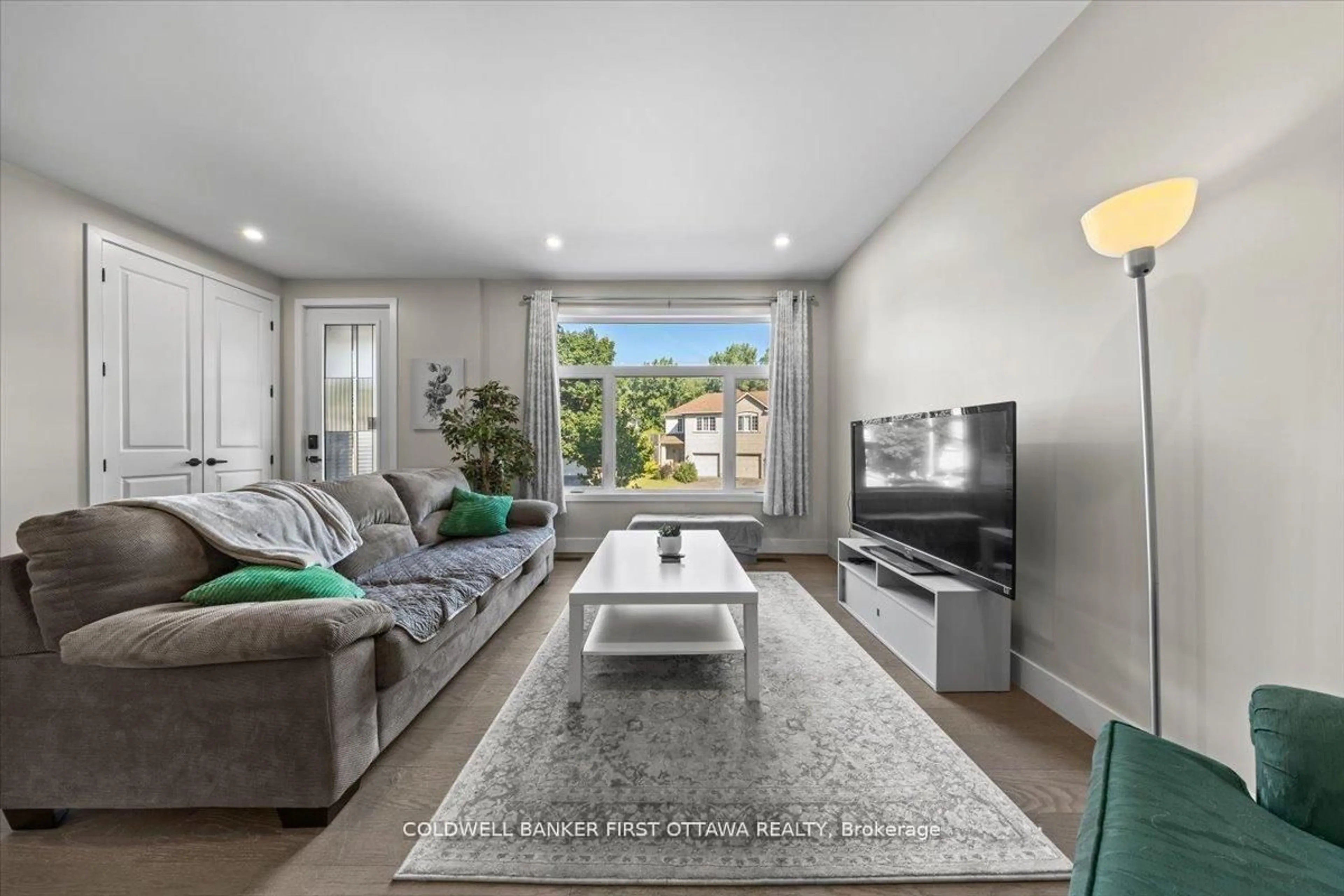 Living room with furniture, unknown for 25 Pennard Way #A & B, Ottawa Ontario K1T 4C1