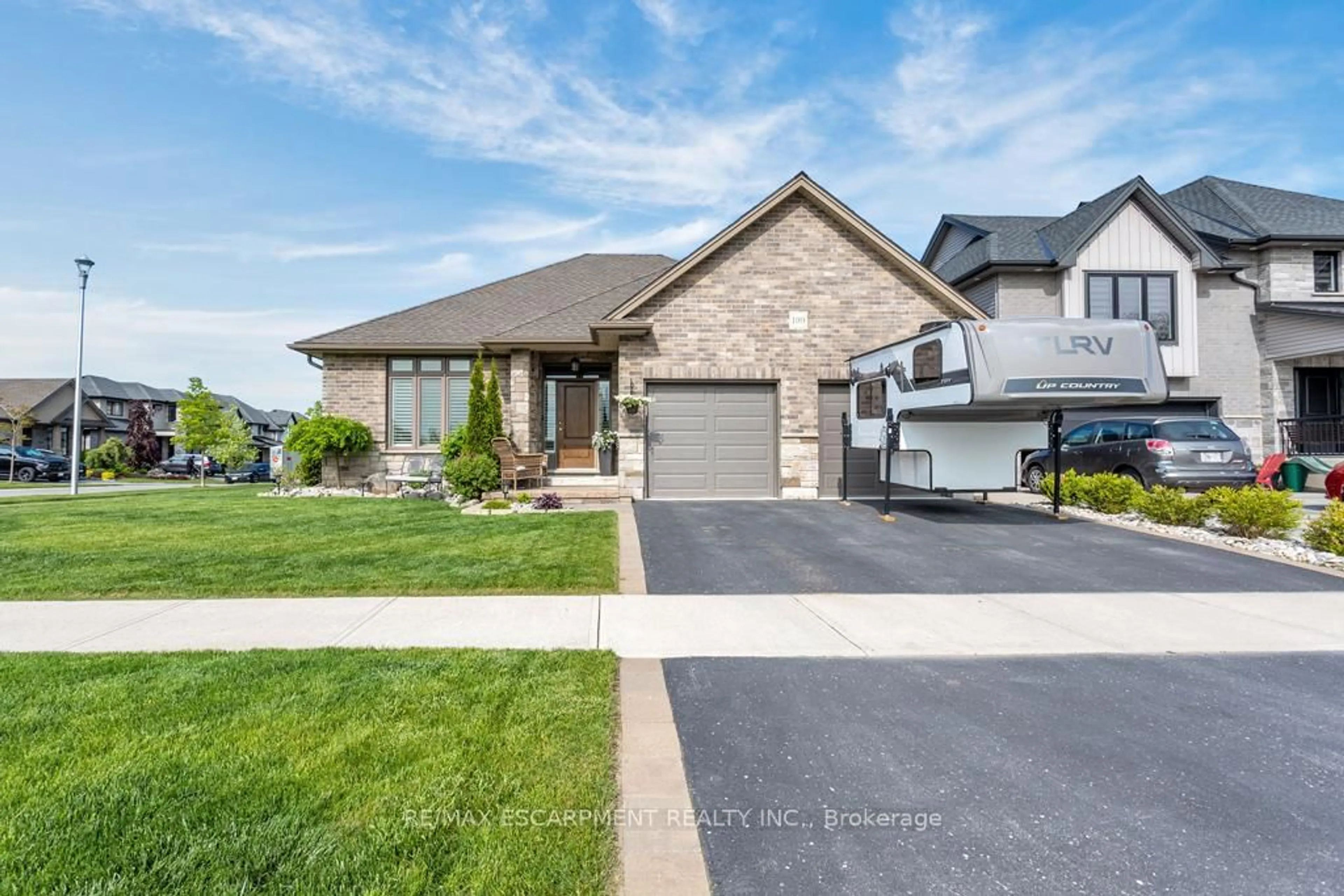 Home with brick exterior material, street for 100 Tamarack Blvd, Woodstock Ontario N4S 0E2