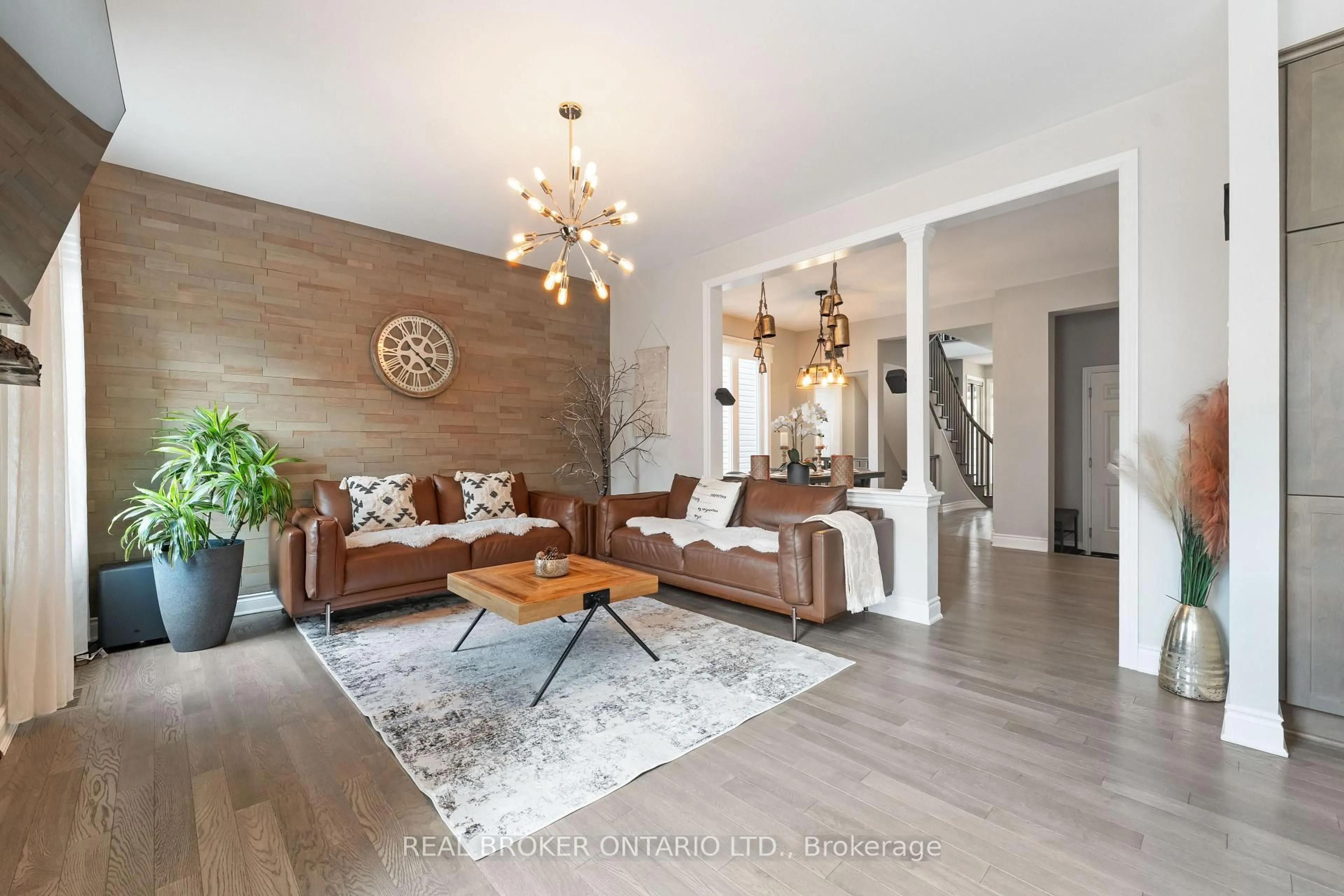 Living room with furniture, wood/laminate floor for 373 River Landing Ave, Ottawa Ontario K2J 6K6