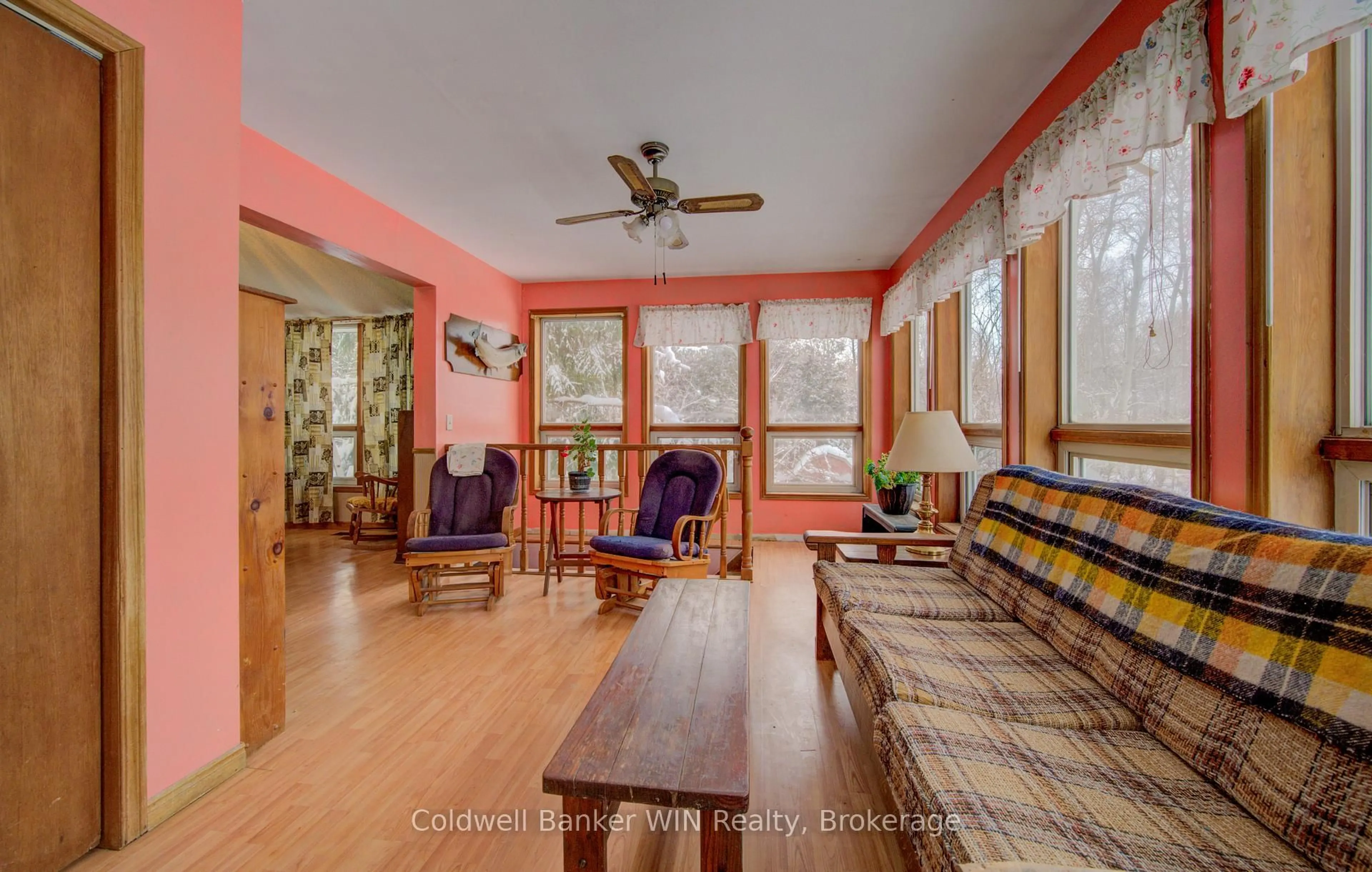 Living room with furniture, wood/laminate floor for 8123 Line 12, Wellington North Ontario N0G 1N0