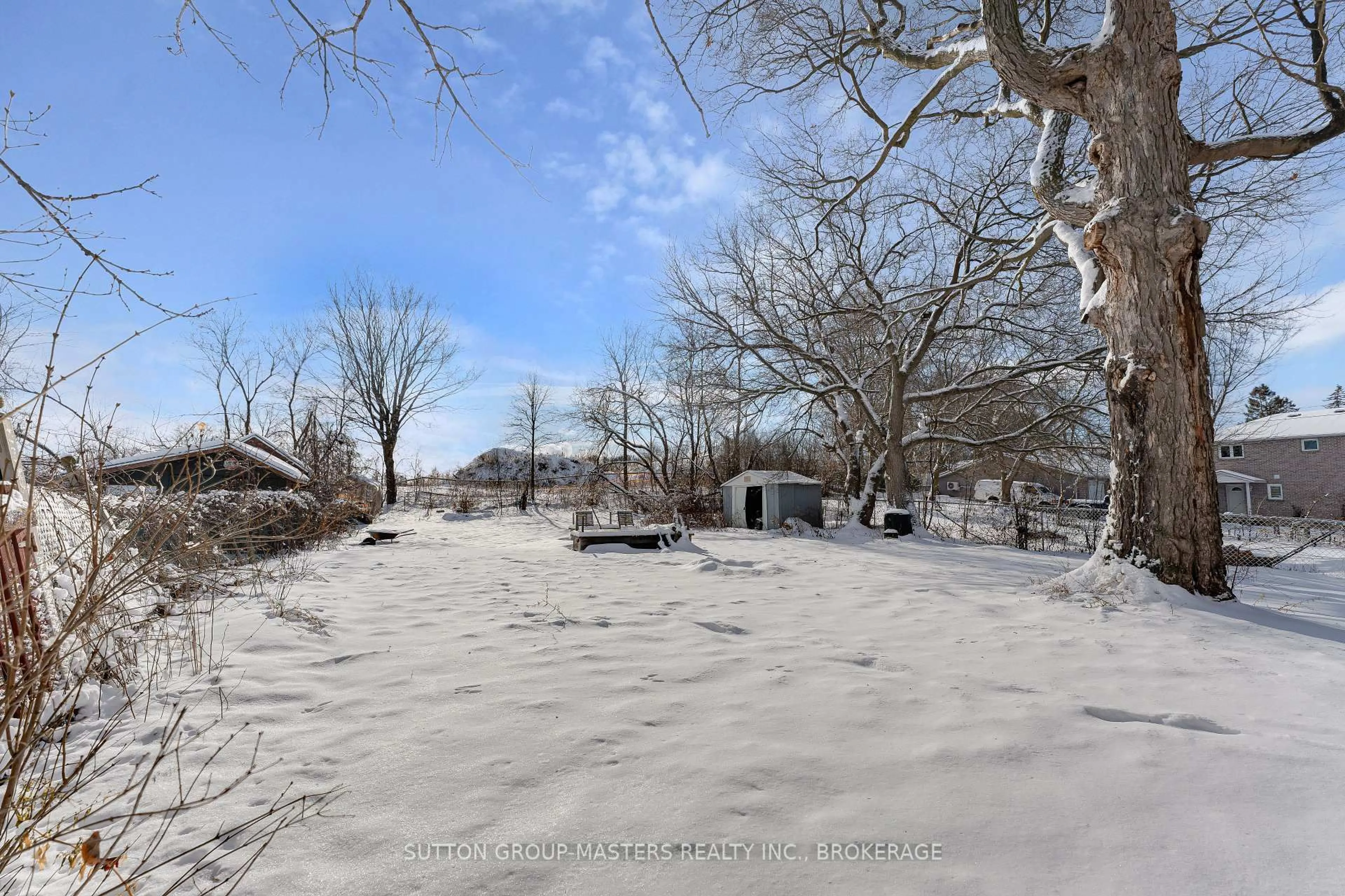 A pic from outside/outdoor area/front of a property/back of a property/a pic from drone, forest/trees view for 18 Greer St, Kingston Ontario K7K 2V9