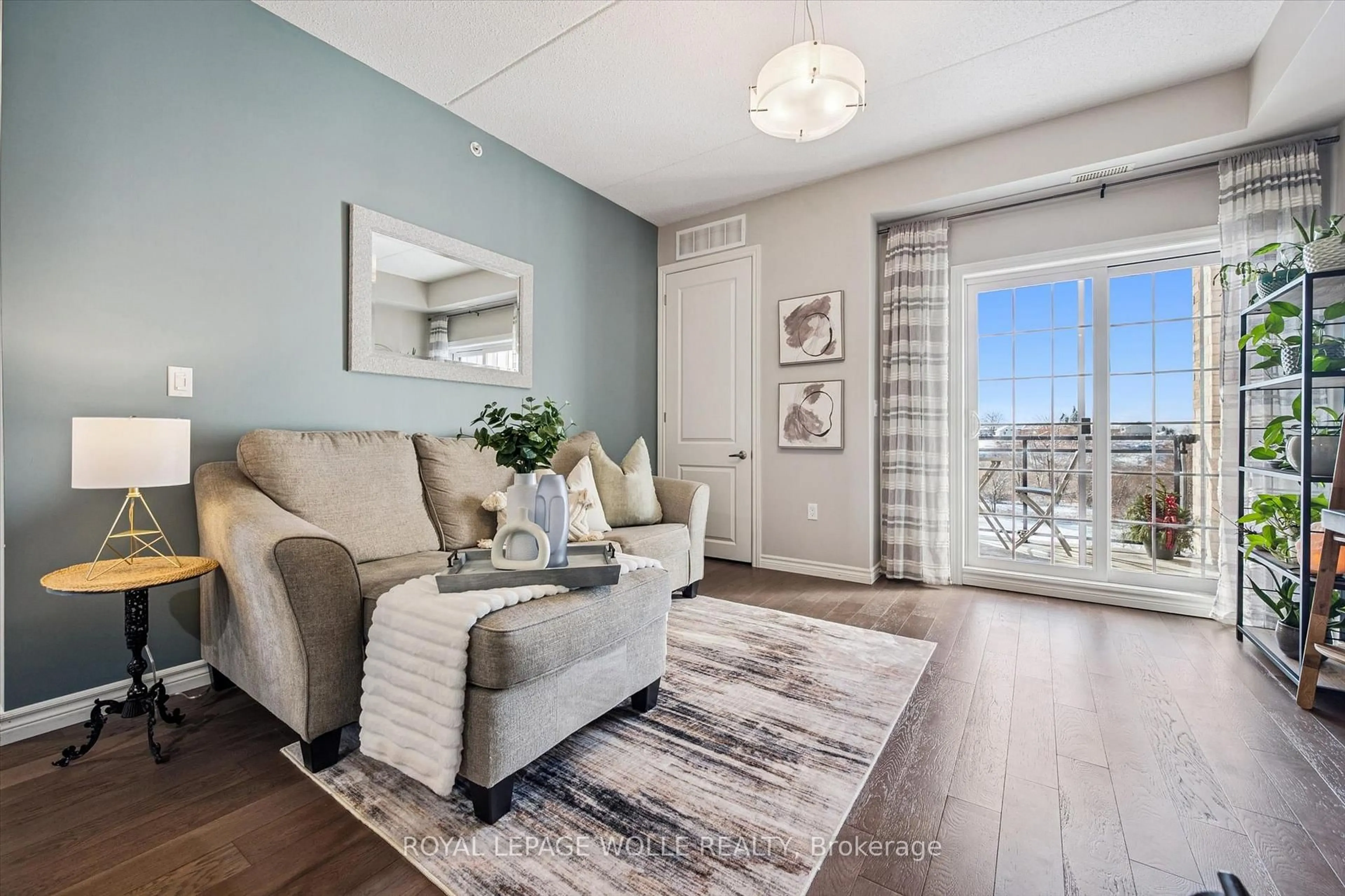 Living room with furniture, wood/laminate floor for 1077 Gordon St #333, Guelph Ontario N1G 0E3