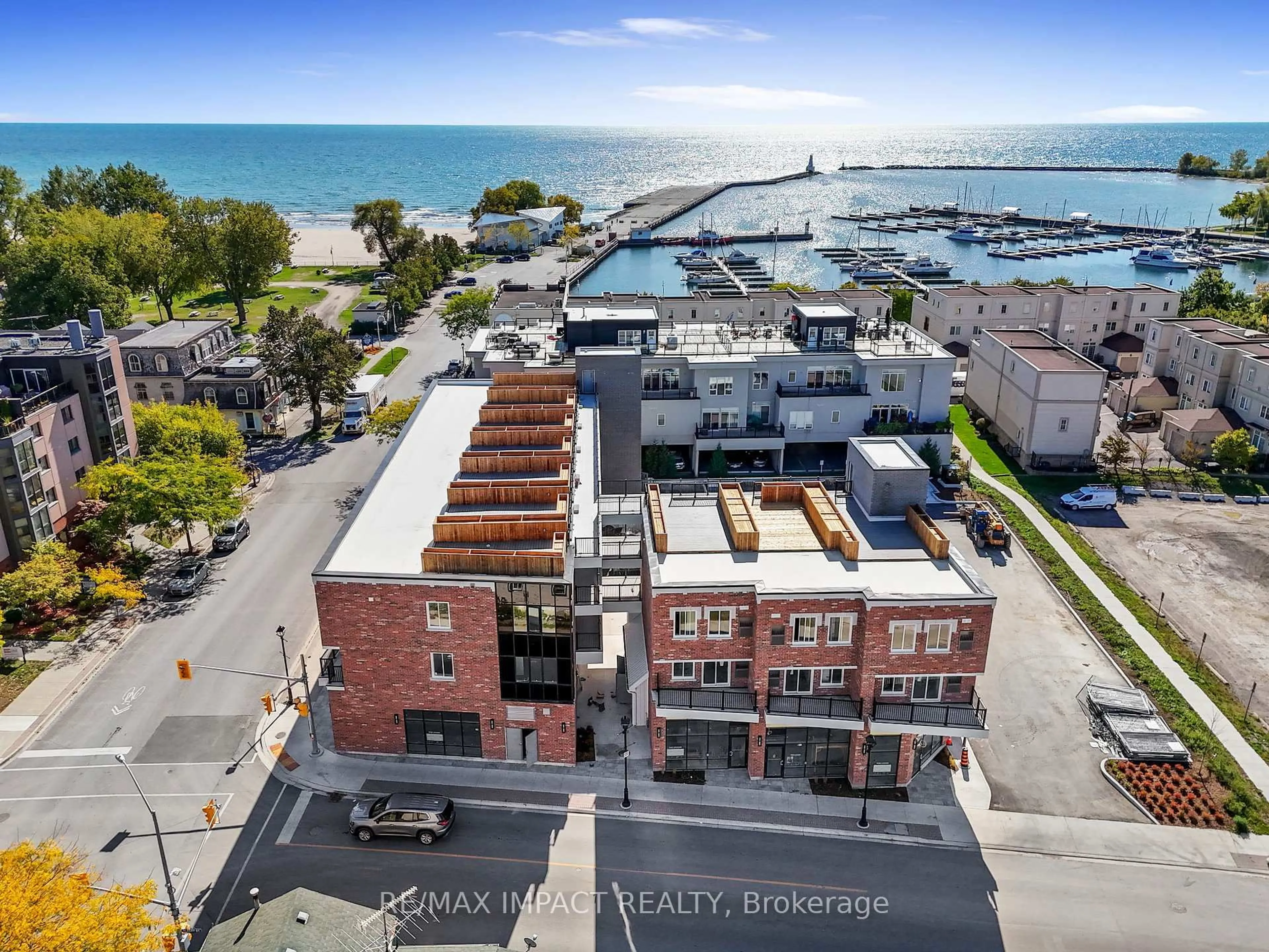 A pic from outside/outdoor area/front of a property/back of a property/a pic from drone, city buildings view from balcony for 185 Division St #108, 208, 308, Cobourg Ontario K9A 4M4