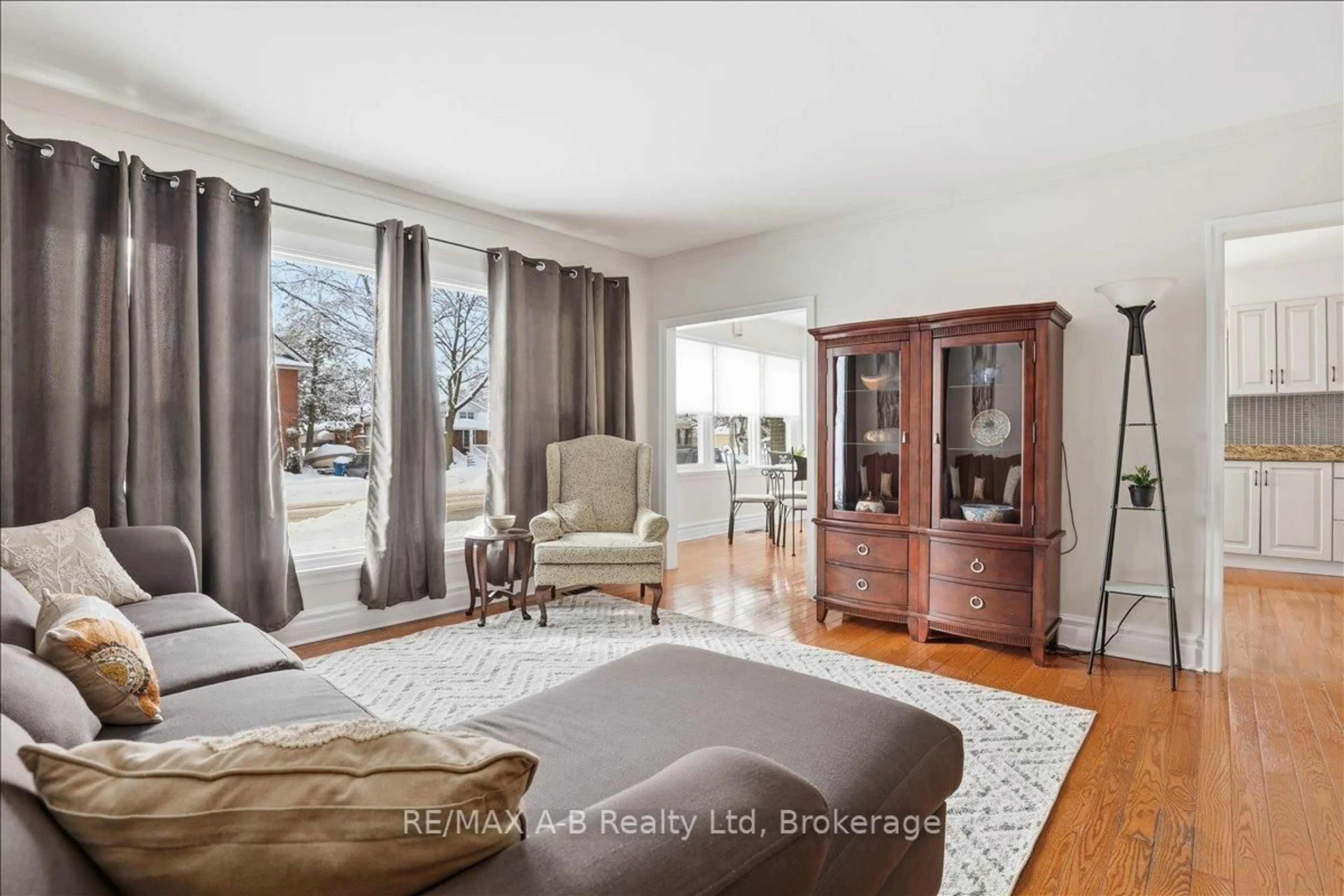 Living room with furniture, wood/laminate floor for 296 Huron St, Stratford Ontario N5A 5T4