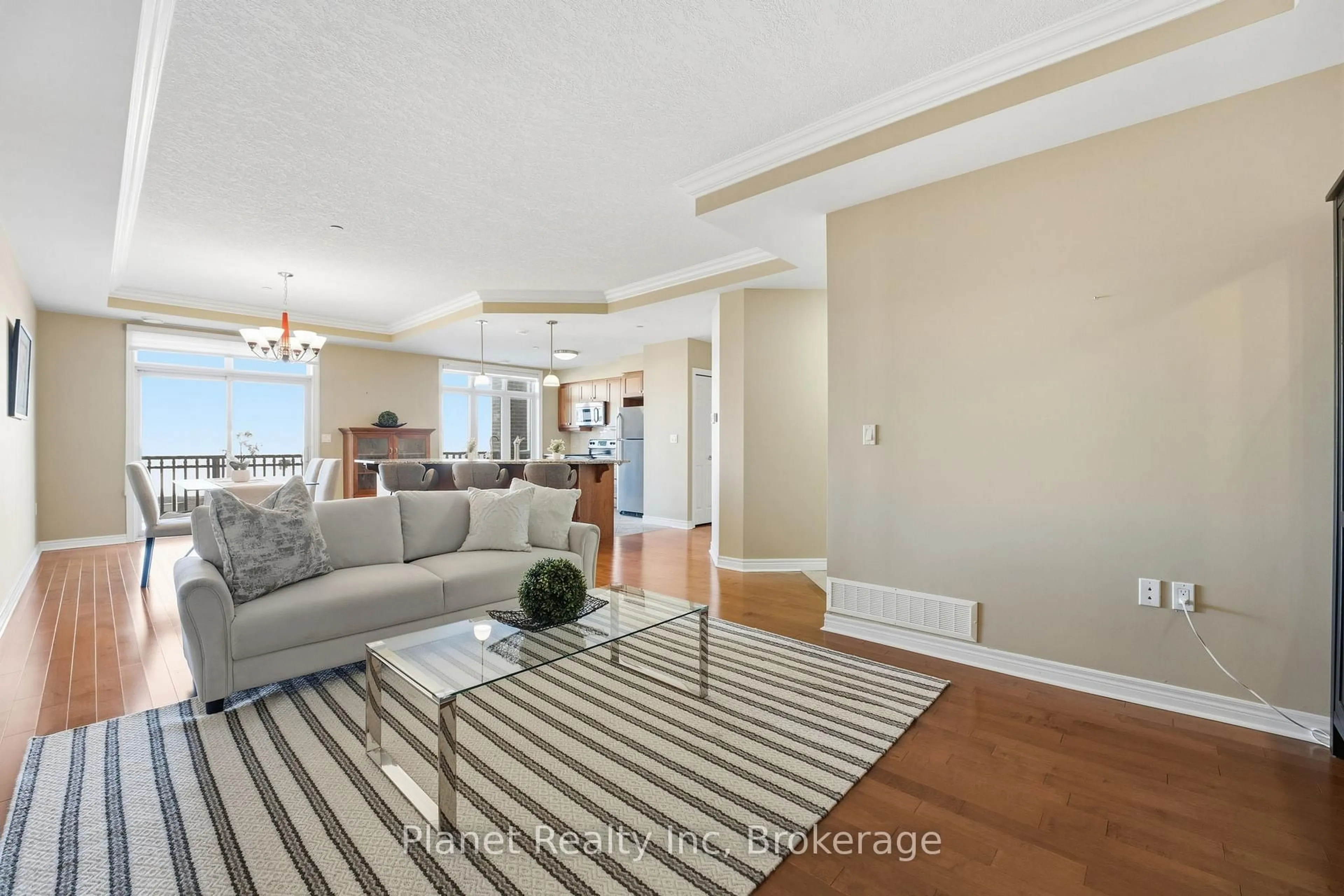 Living room with furniture, unknown for 65 BAYBERRY Dr #C305, Guelph Ontario N1G 5K8