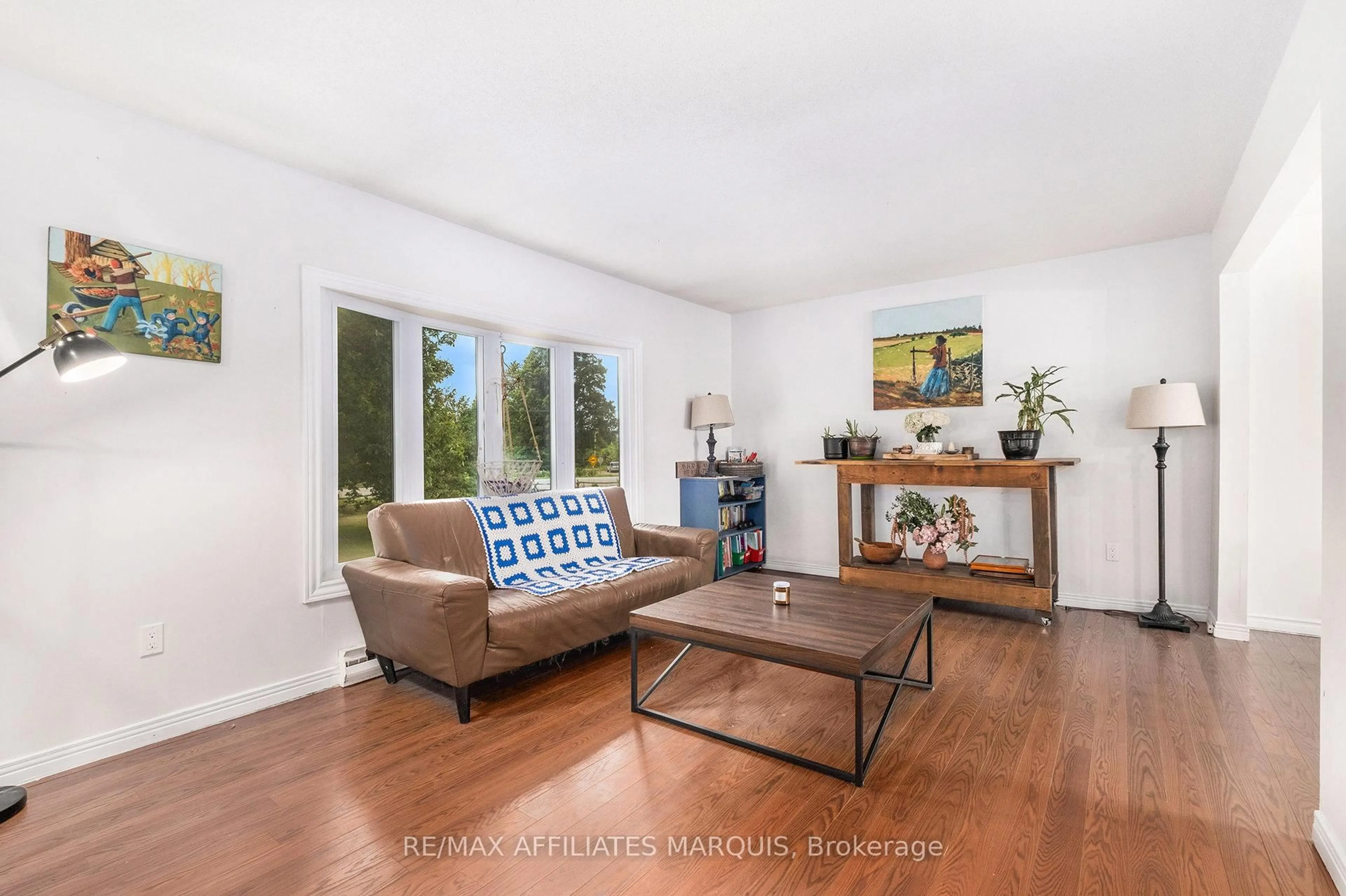 Living room with furniture, wood/laminate floor for 222 Townline Rd, Rideau Lakes Ontario K0G 1L0