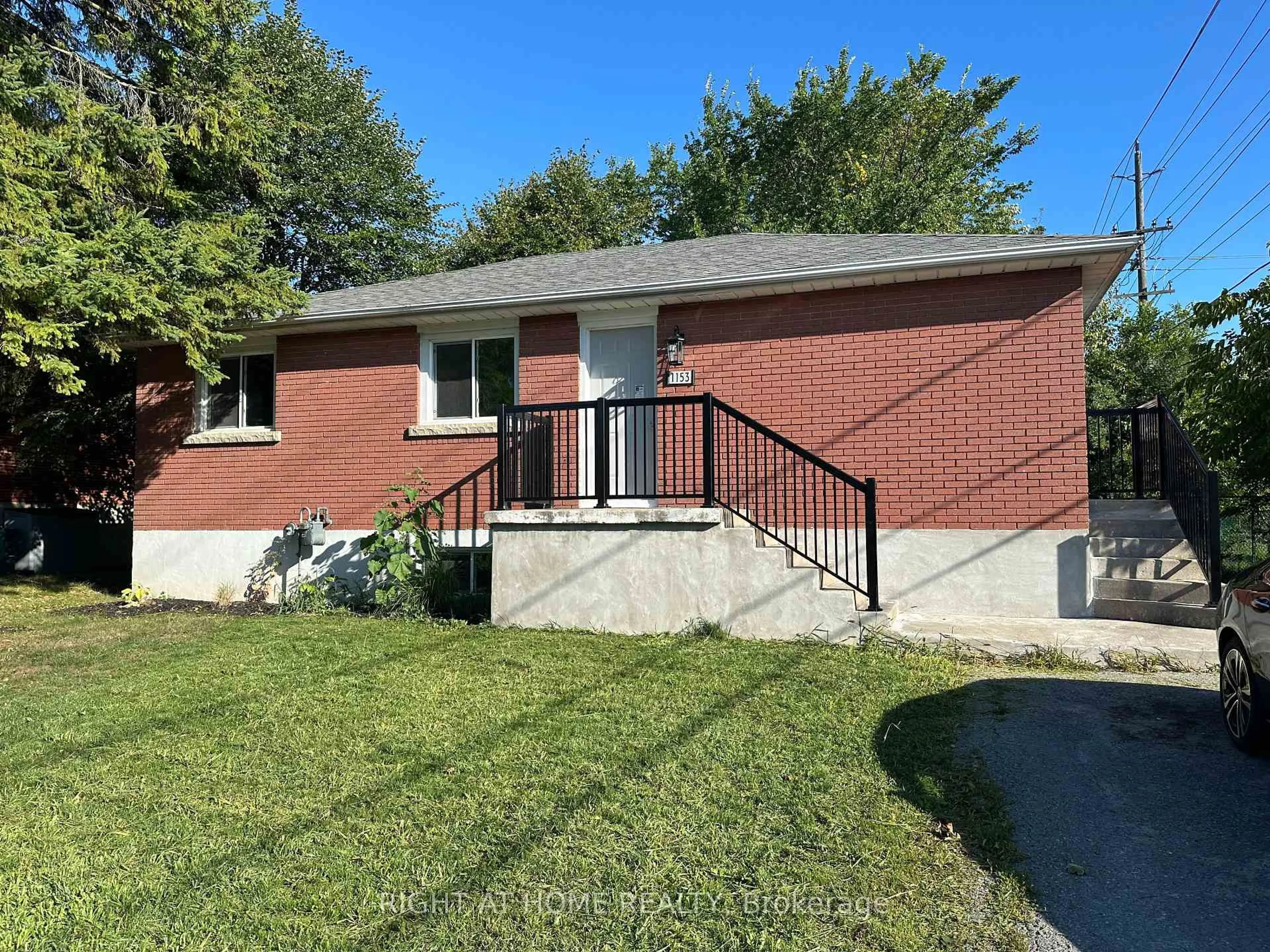 Home with brick exterior material, street for 1153 Johnson St, Kingston Ontario K7M 2N9