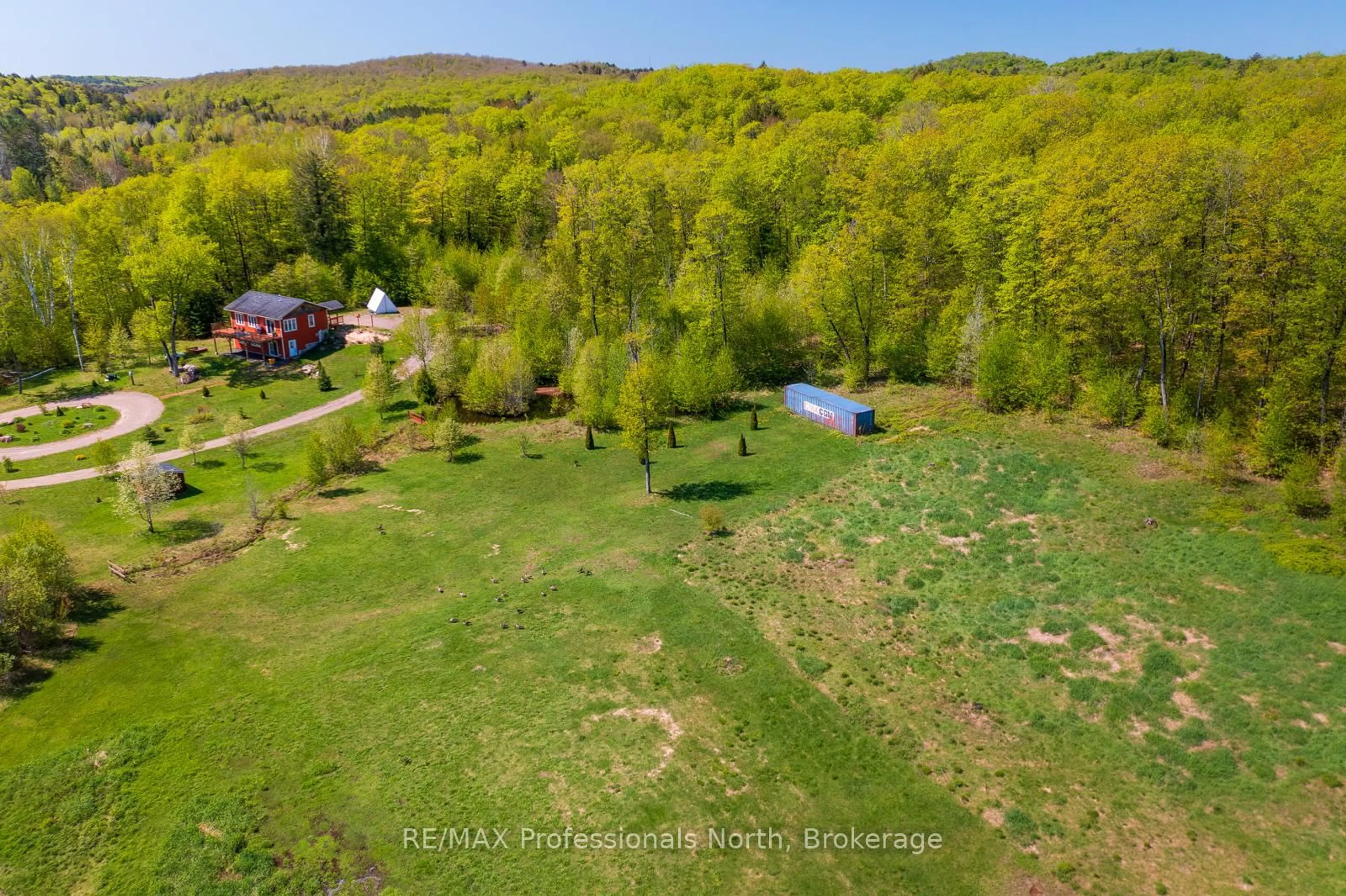 A pic from outside/outdoor area/front of a property/back of a property/a pic from drone, water/lake/river/ocean view for 4043 Highway 60, Algonquin Highlands Ontario P0A 1H0