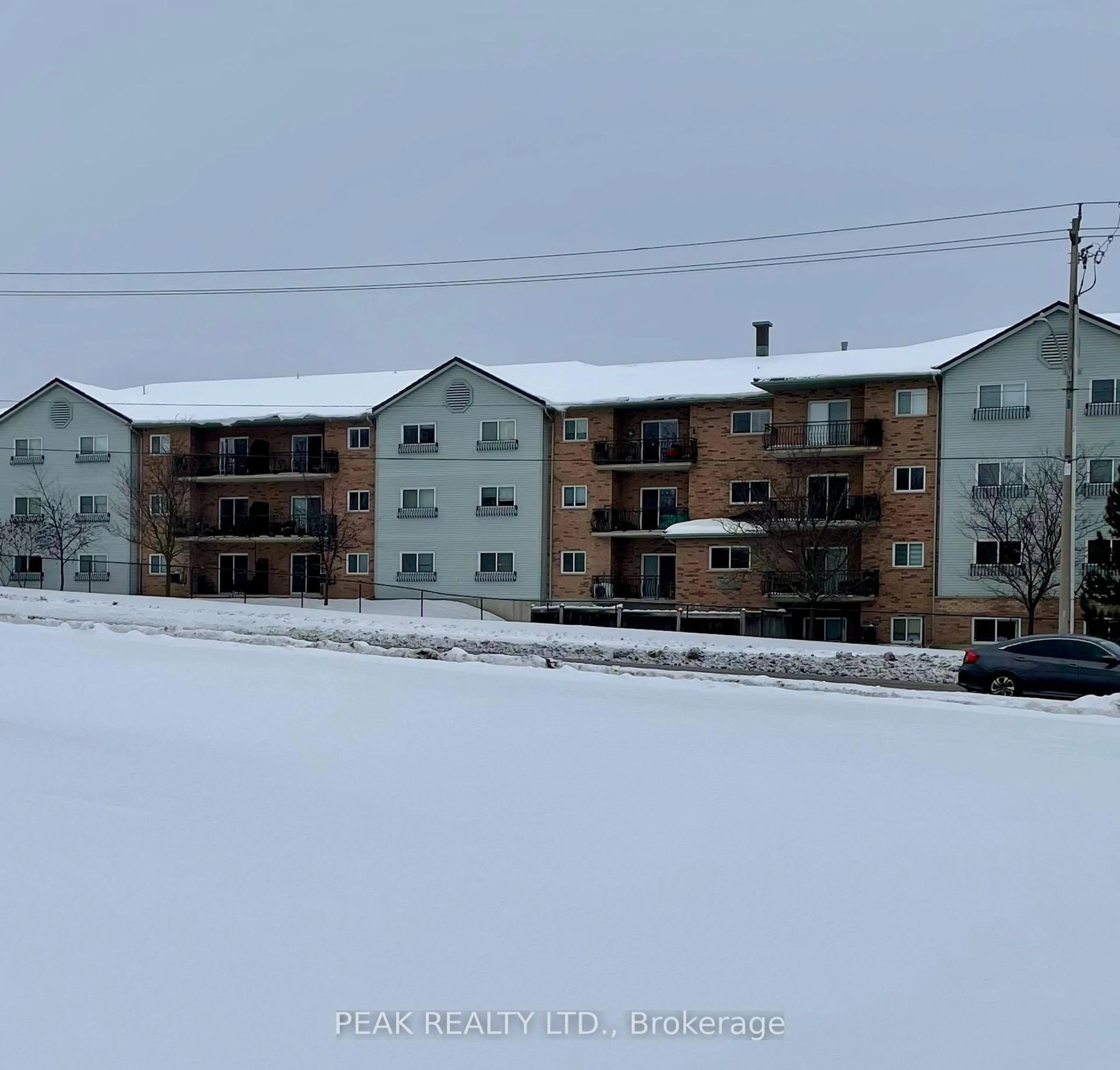 A pic from outside/outdoor area/front of a property/back of a property/a pic from drone, unknown for 345 Briarmeadow Dr #206, Kitchener Ontario N2A 4J6