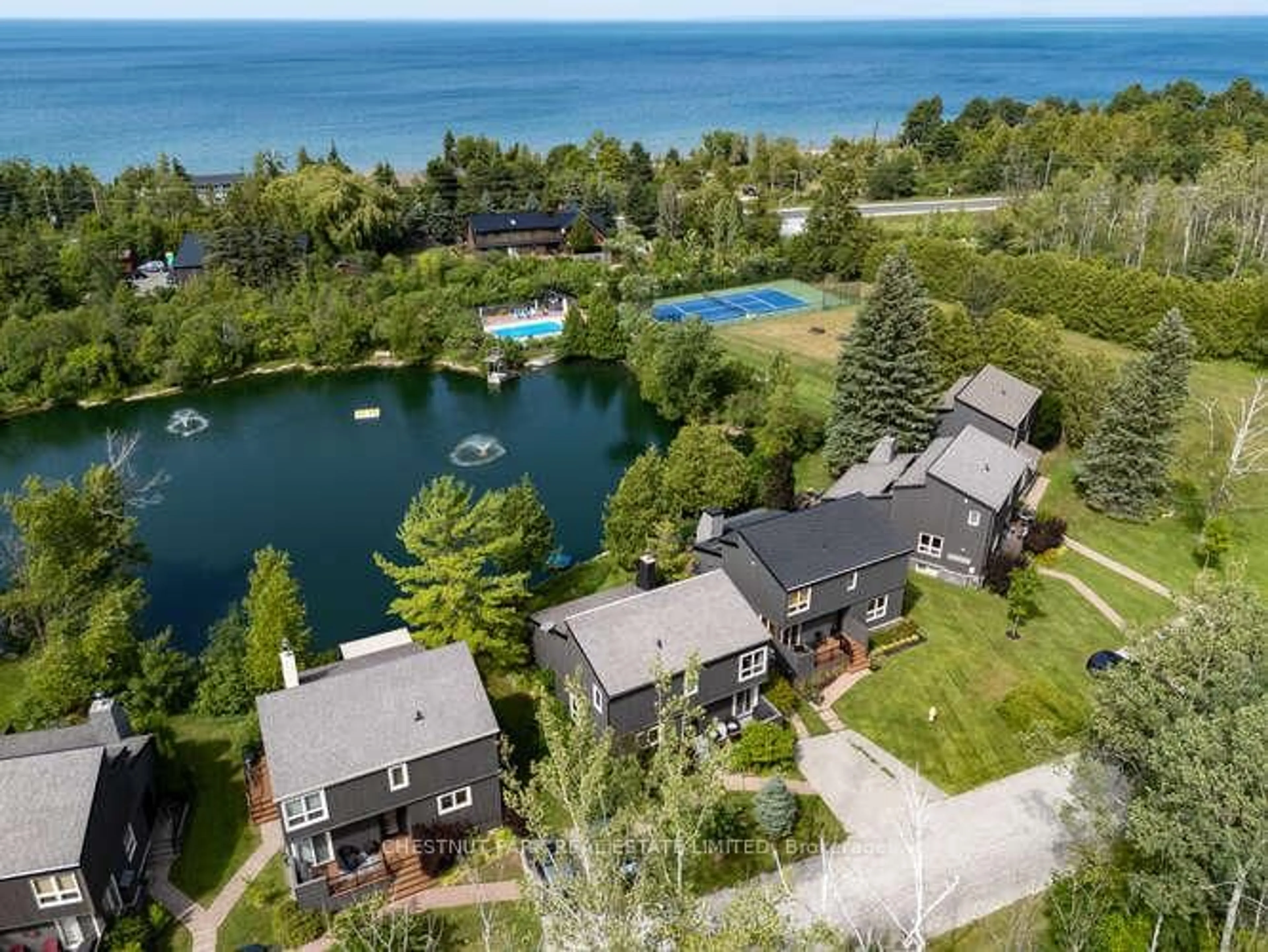 A pic from outside/outdoor area/front of a property/back of a property/a pic from drone, water/lake/river/ocean view for 116 Hidden Lake Rd #9, Blue Mountains Ontario L9Y 0T6