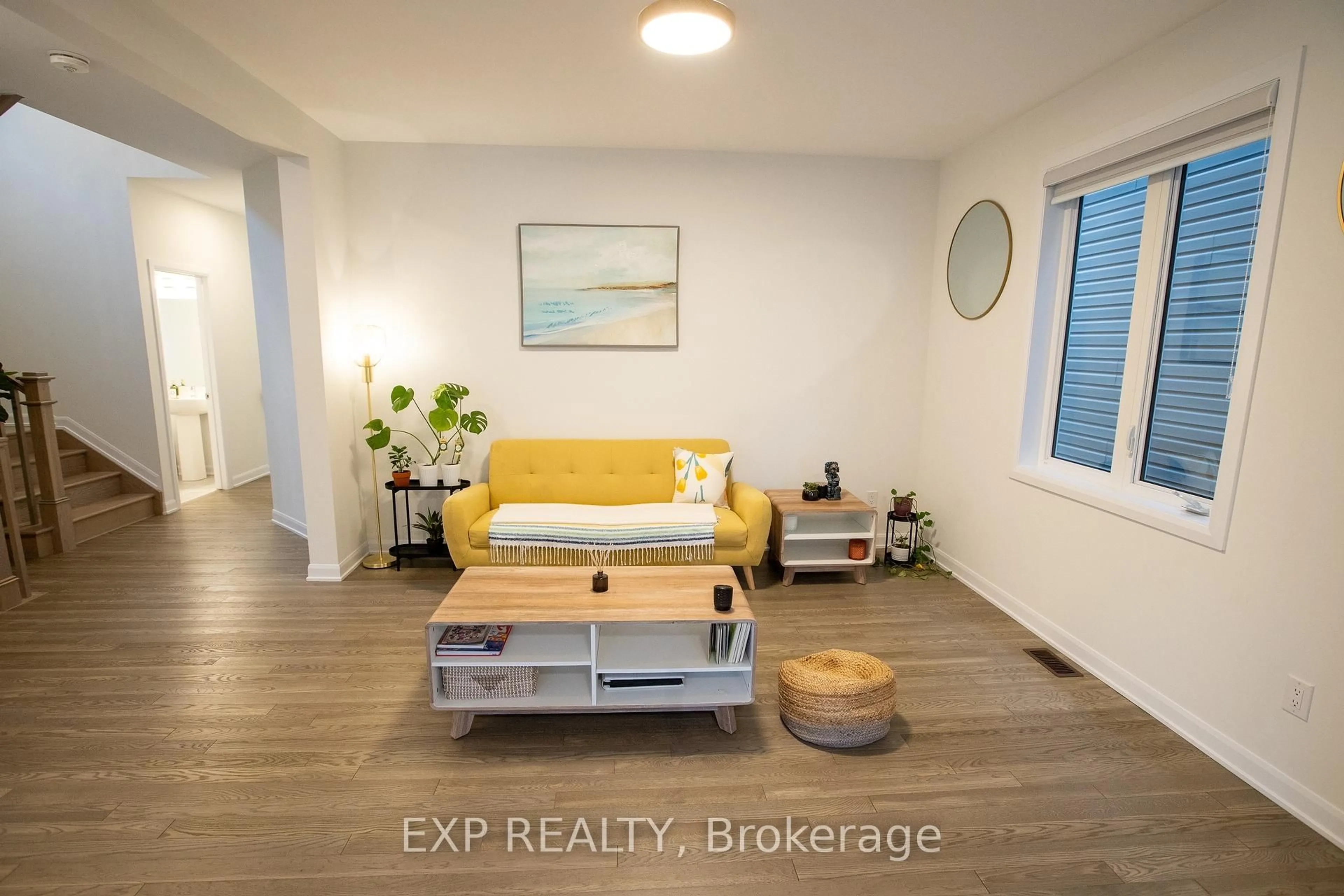 Living room with furniture, wood/laminate floor for 137 Maynooth Crt, Ottawa Ontario K2J 6Y4