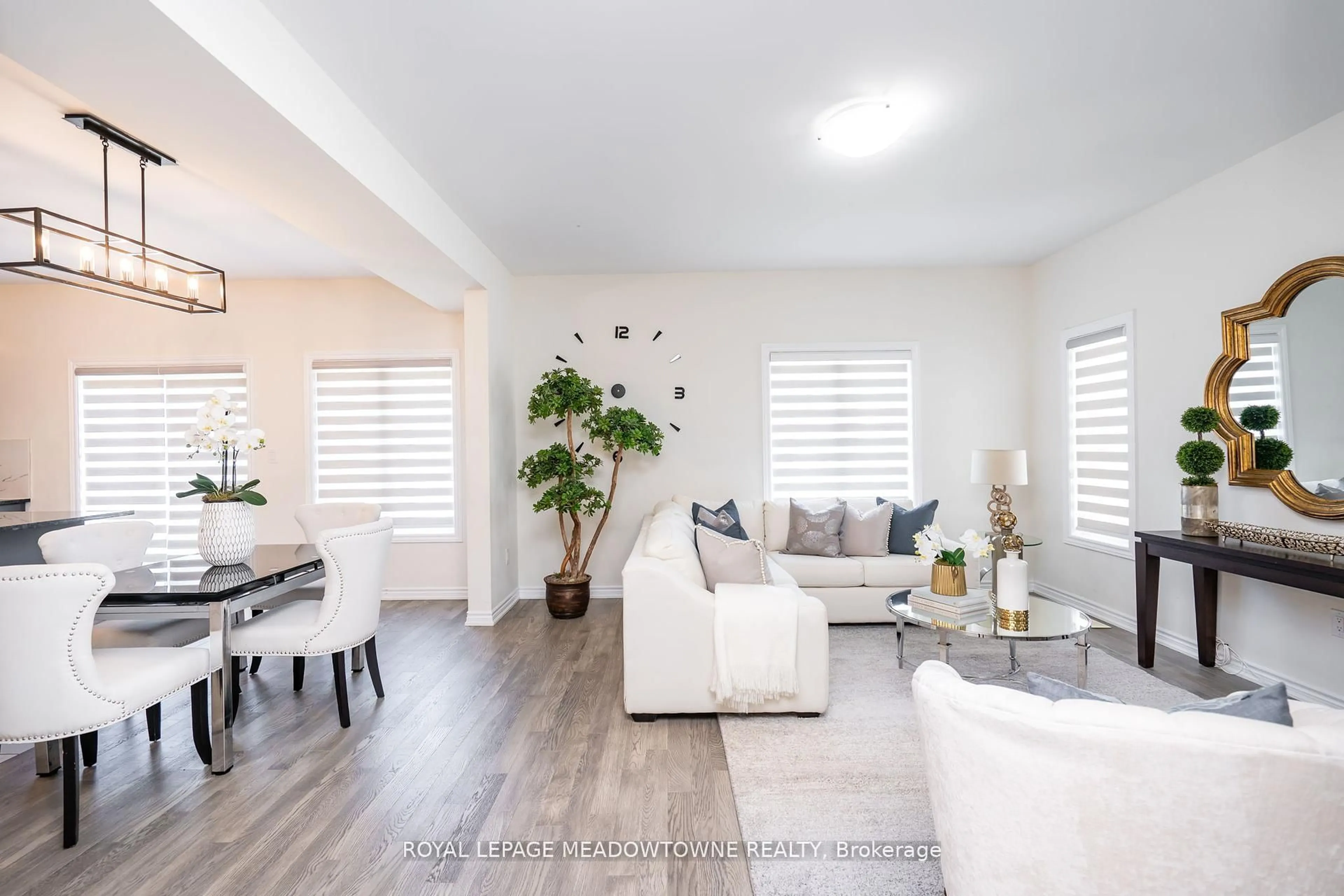 Living room with furniture, wood/laminate floor for 16 Bethune Ave, Welland Ontario L3B 0H5