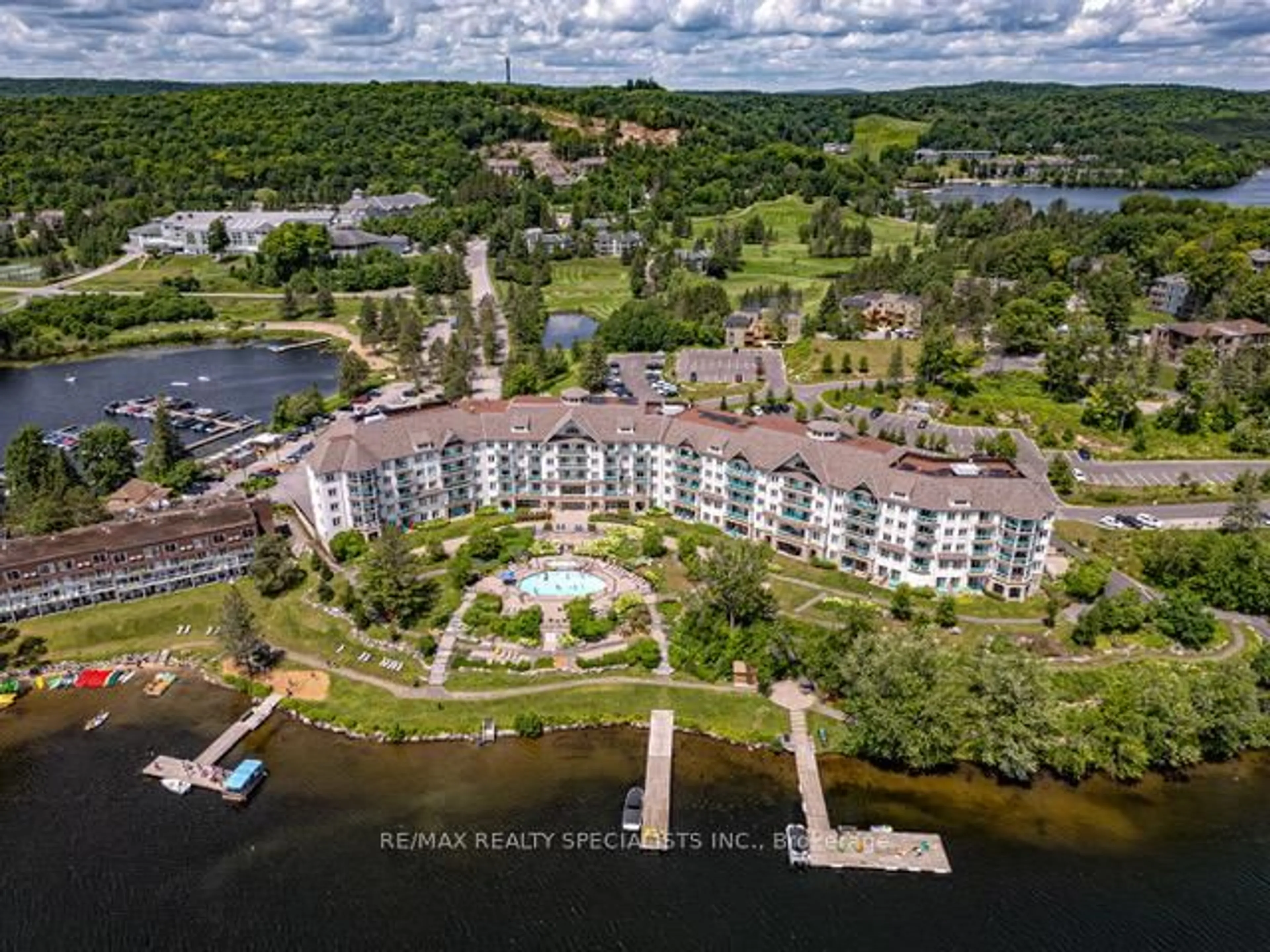 A pic from outside/outdoor area/front of a property/back of a property/a pic from drone, water/lake/river/ocean view for 25 Pen Lake Point Rd #230, Huntsville Ontario P1H 1A9