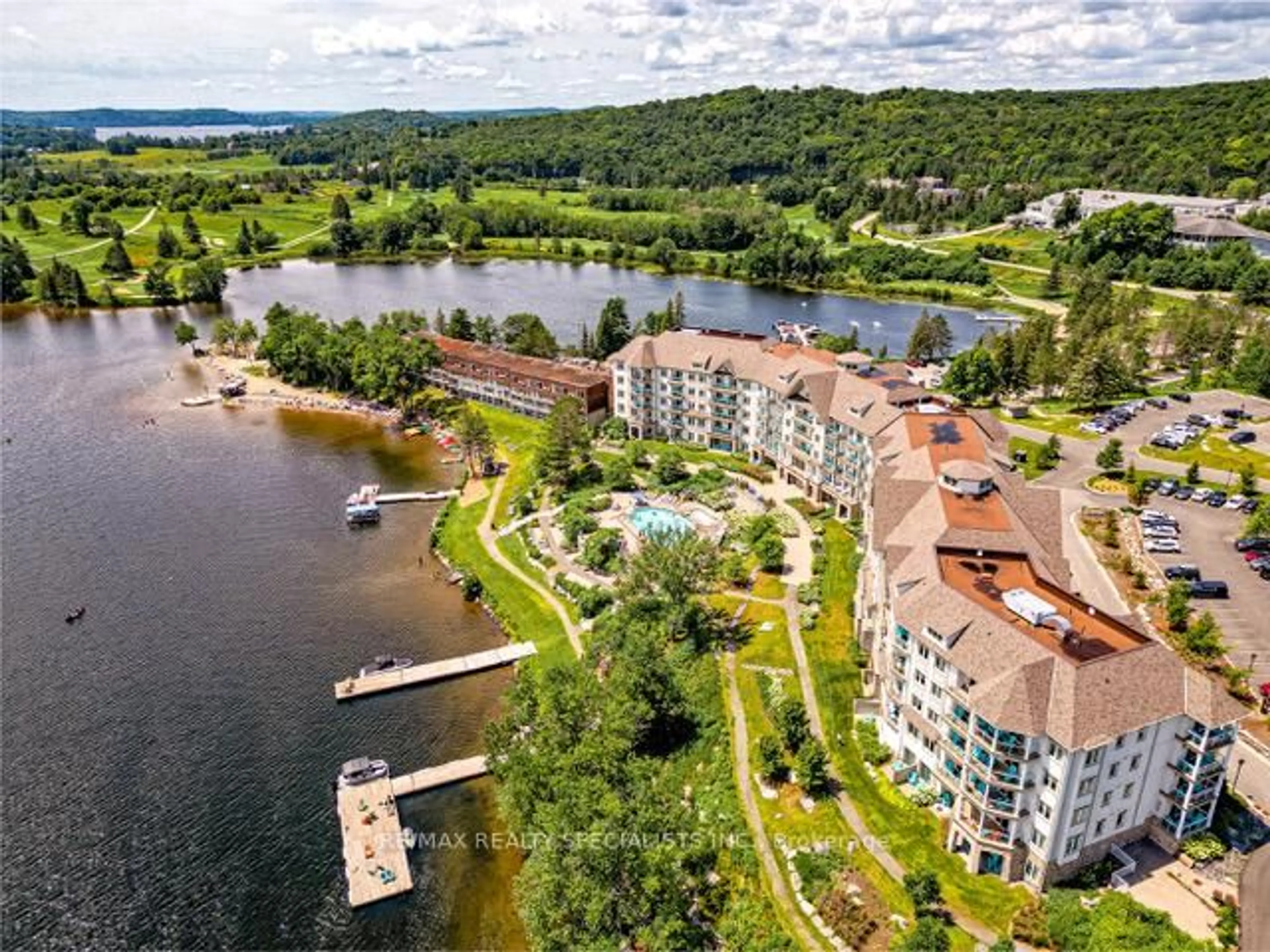 A pic from outside/outdoor area/front of a property/back of a property/a pic from drone, water/lake/river/ocean view for 25 Pen Lake Point Rd #230, Huntsville Ontario P1H 1A9