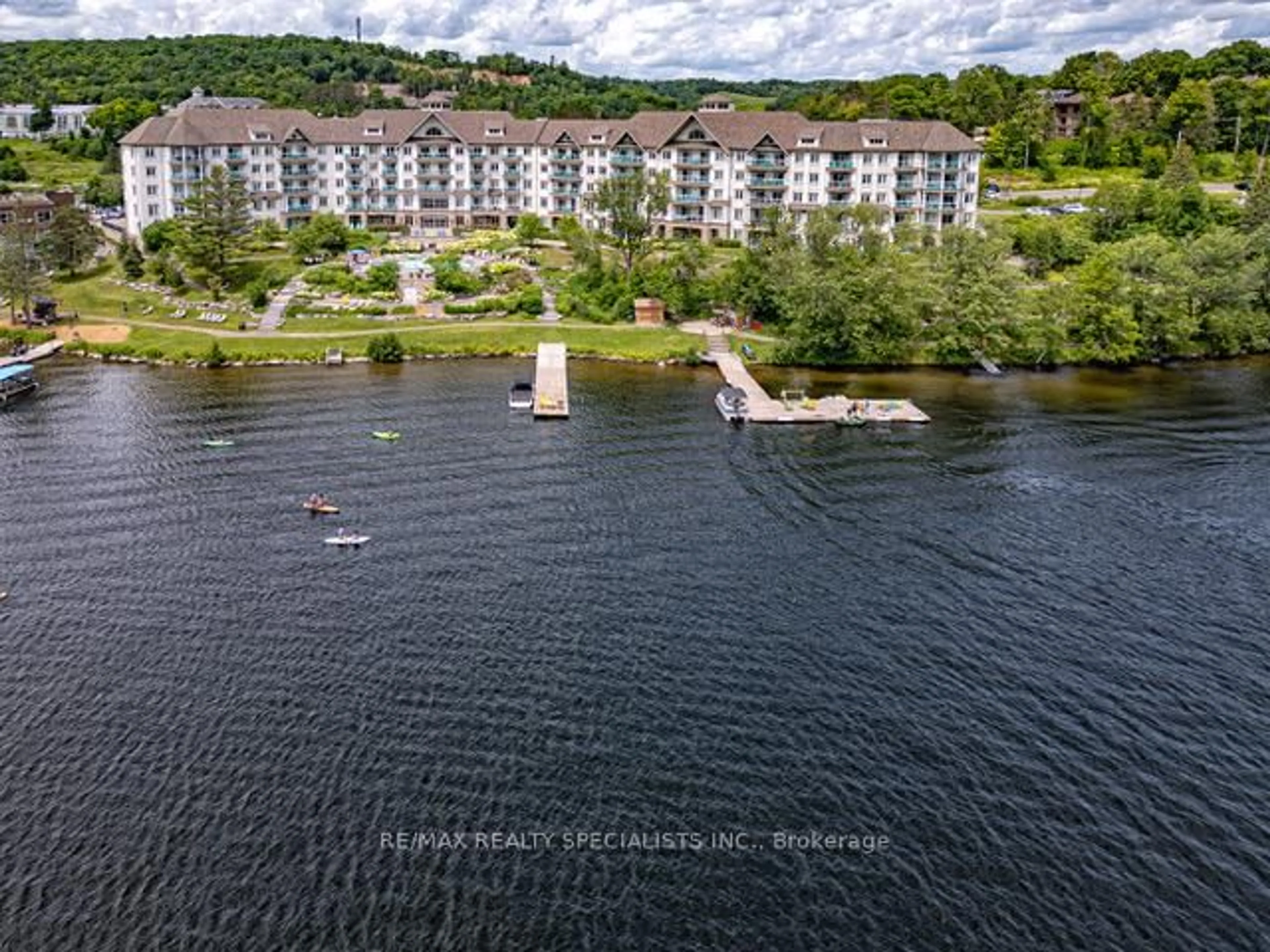 A pic from outside/outdoor area/front of a property/back of a property/a pic from drone, water/lake/river/ocean view for 25 Pen Lake Point Rd #230, Huntsville Ontario P1H 1A9