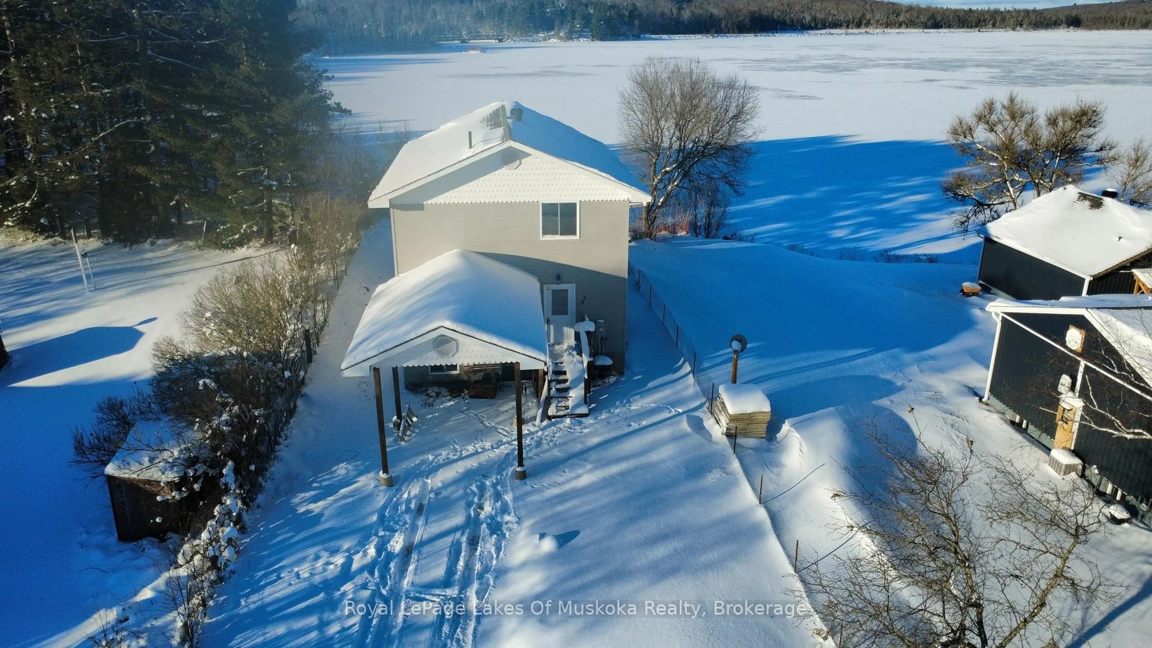 A pic from outside/outdoor area/front of a property/back of a property/a pic from drone, water/lake/river/ocean view for 38 Ottawa Ave, South River Ontario P0A 1X0