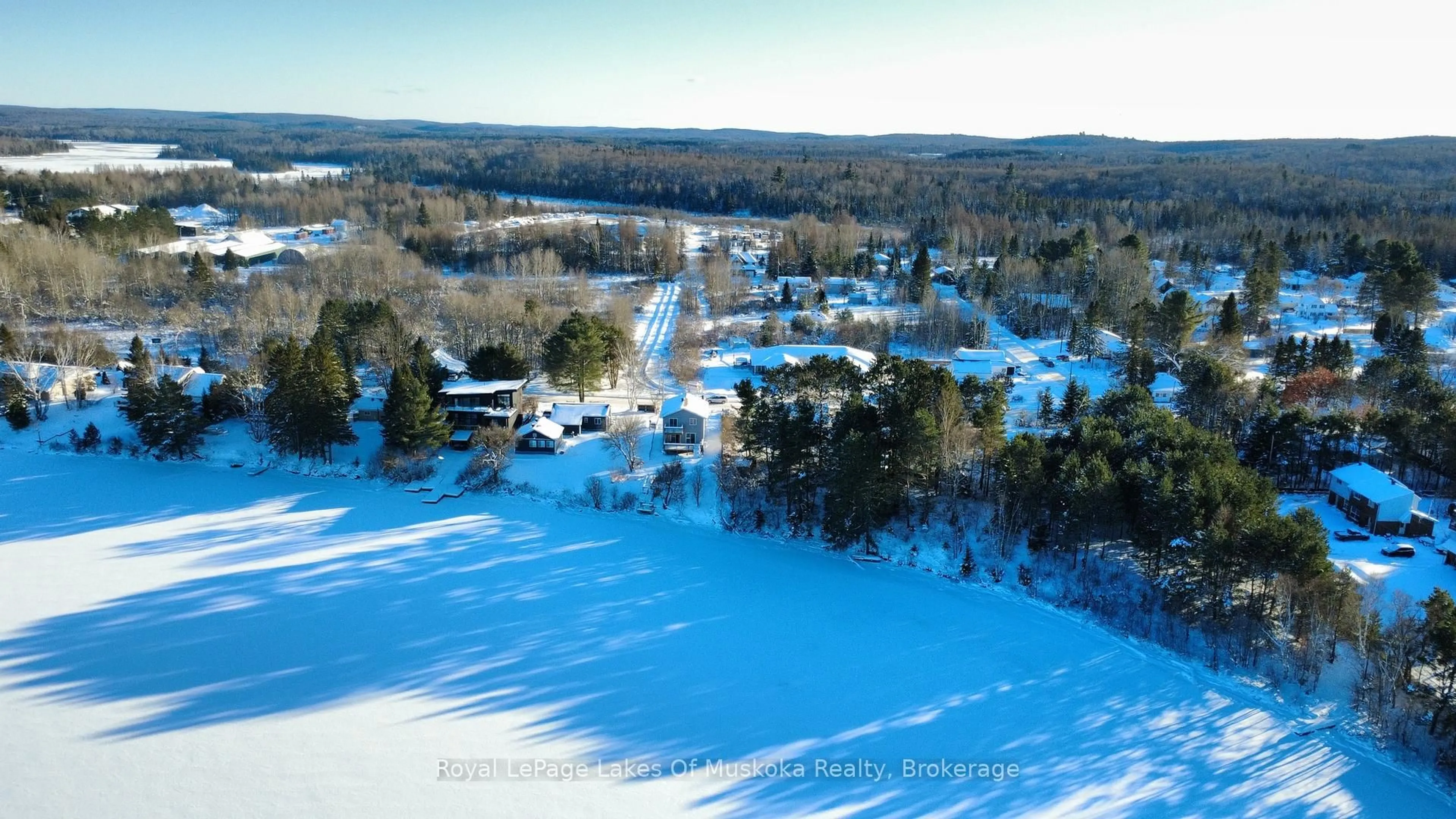 A pic from outside/outdoor area/front of a property/back of a property/a pic from drone, water/lake/river/ocean view for 38 Ottawa Ave, South River Ontario P0A 1X0