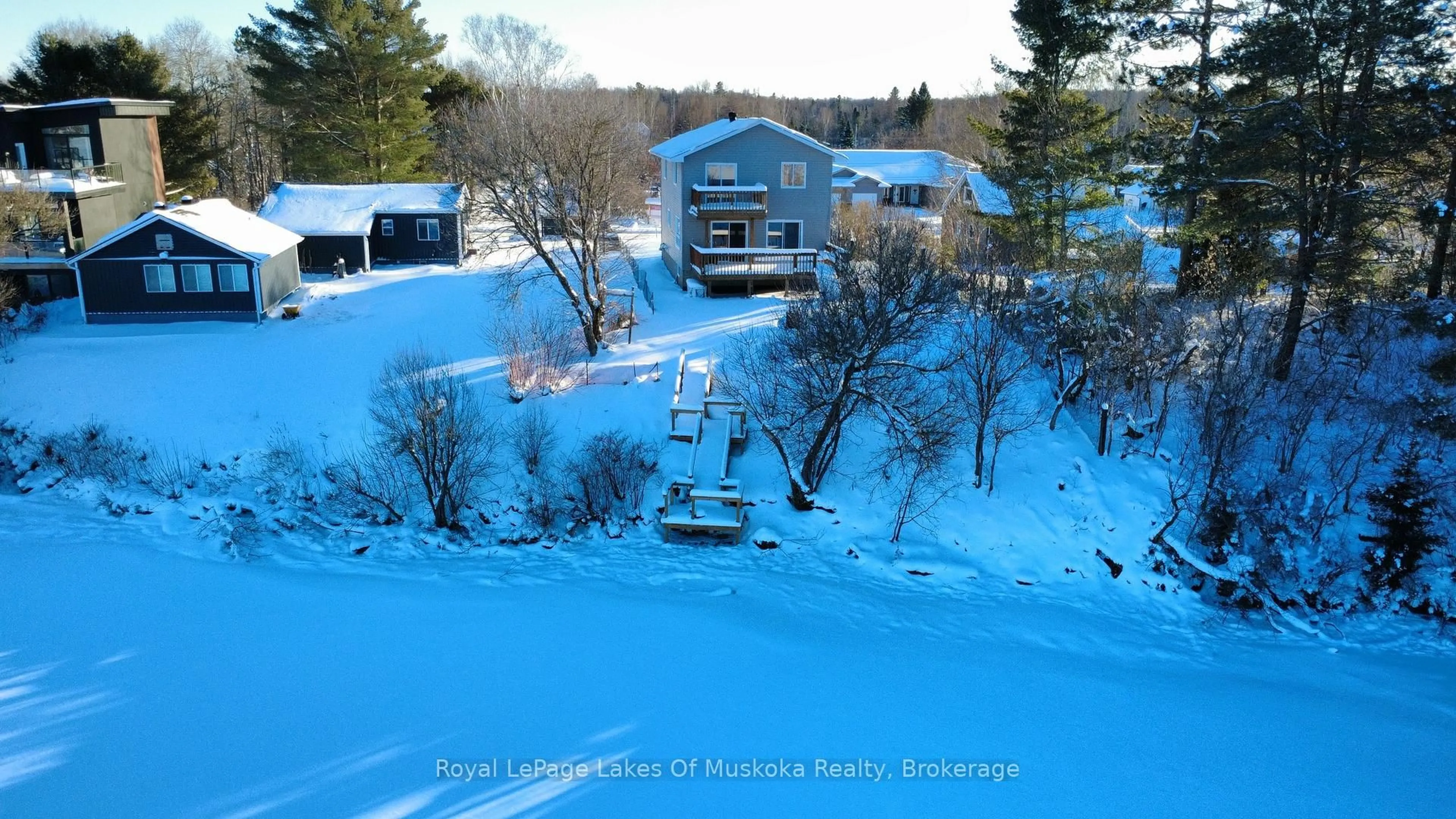 A pic from outside/outdoor area/front of a property/back of a property/a pic from drone, water/lake/river/ocean view for 38 Ottawa Ave, South River Ontario P0A 1X0