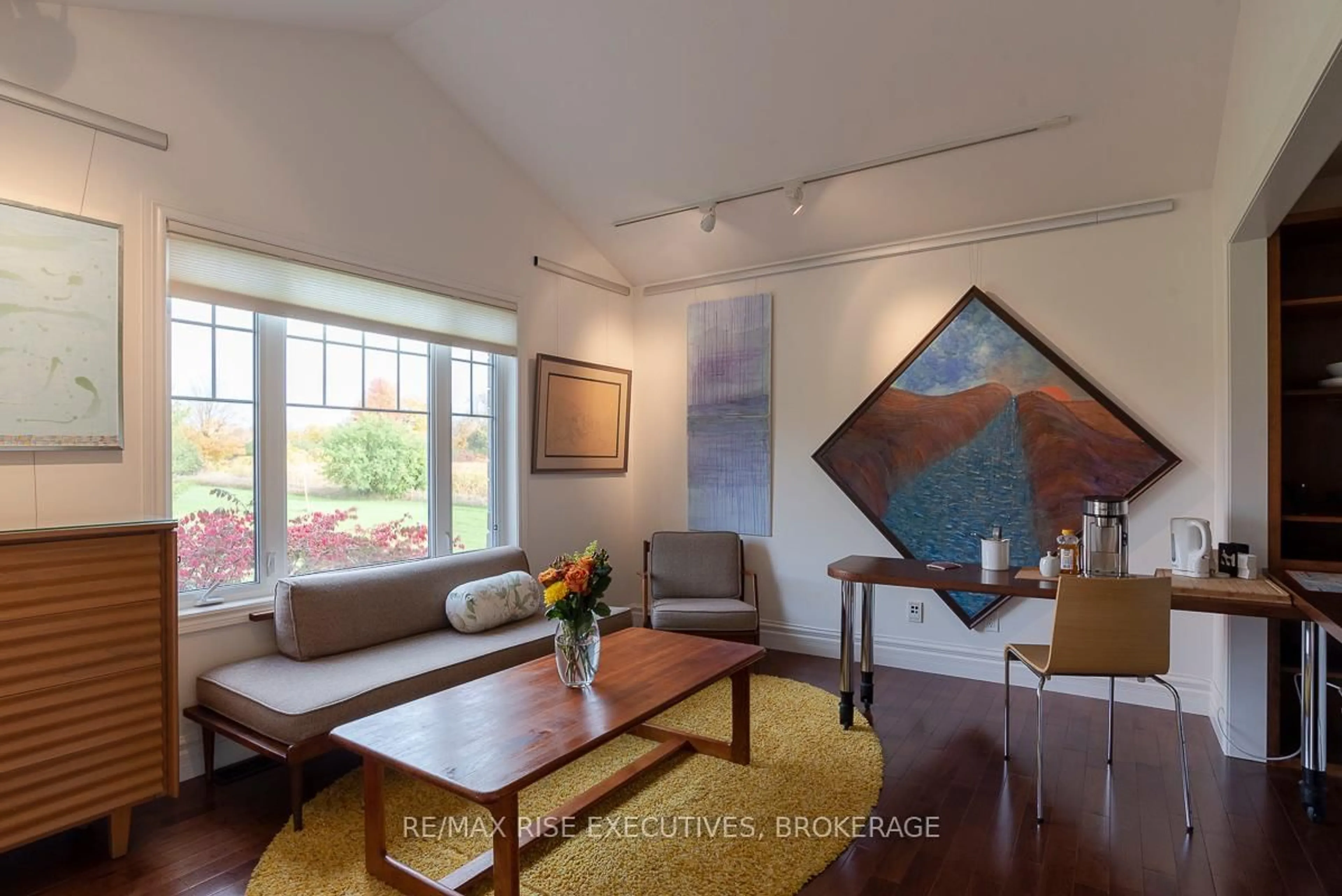 Living room with furniture, wood/laminate floor for 281 Gilead Rd, Prince Edward County Ontario K0K 1G0