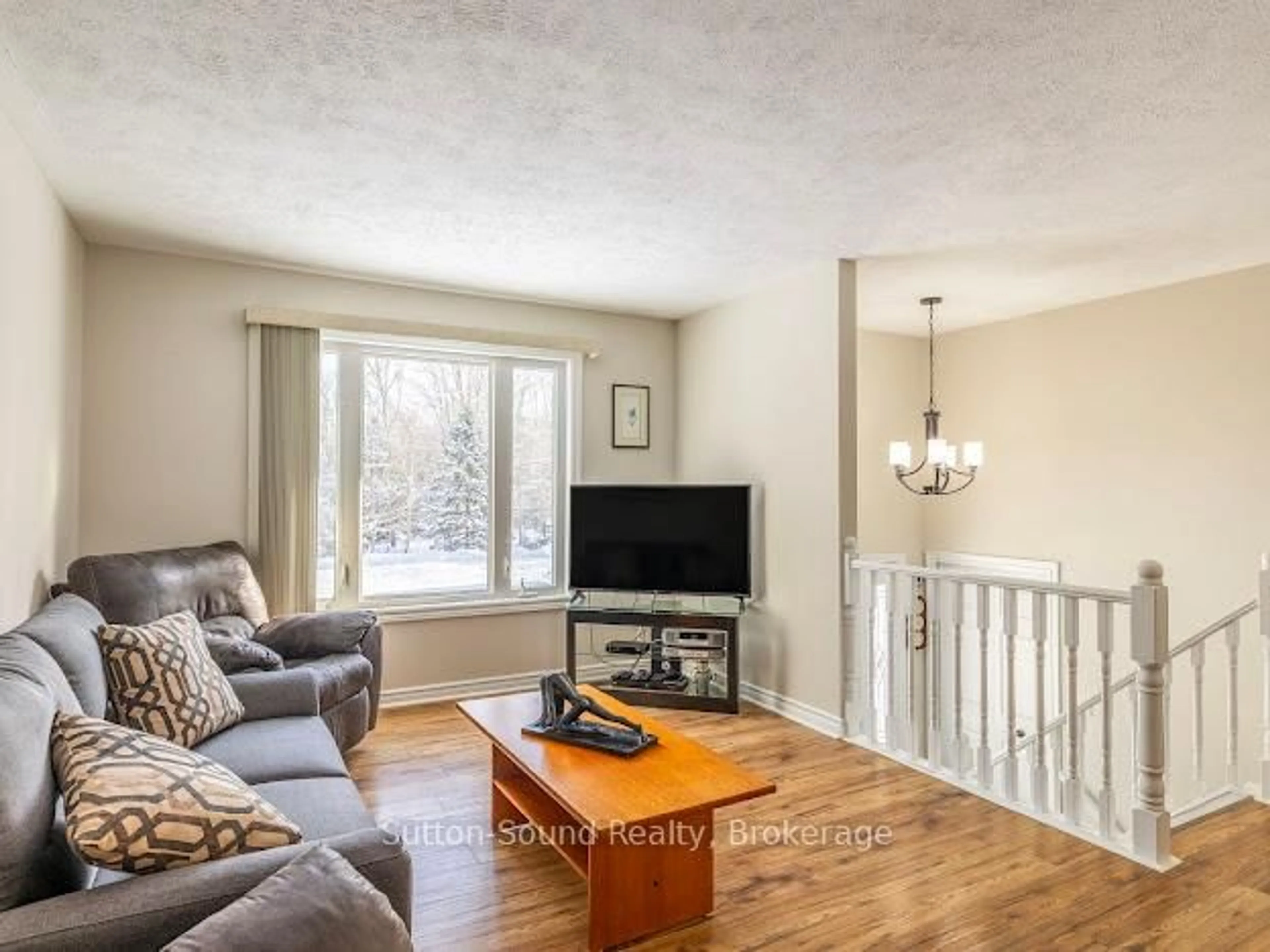 Living room with furniture, wood/laminate floor for 240135 Wilcox Sdrd, Georgian Bluffs Ontario N4K 5N7