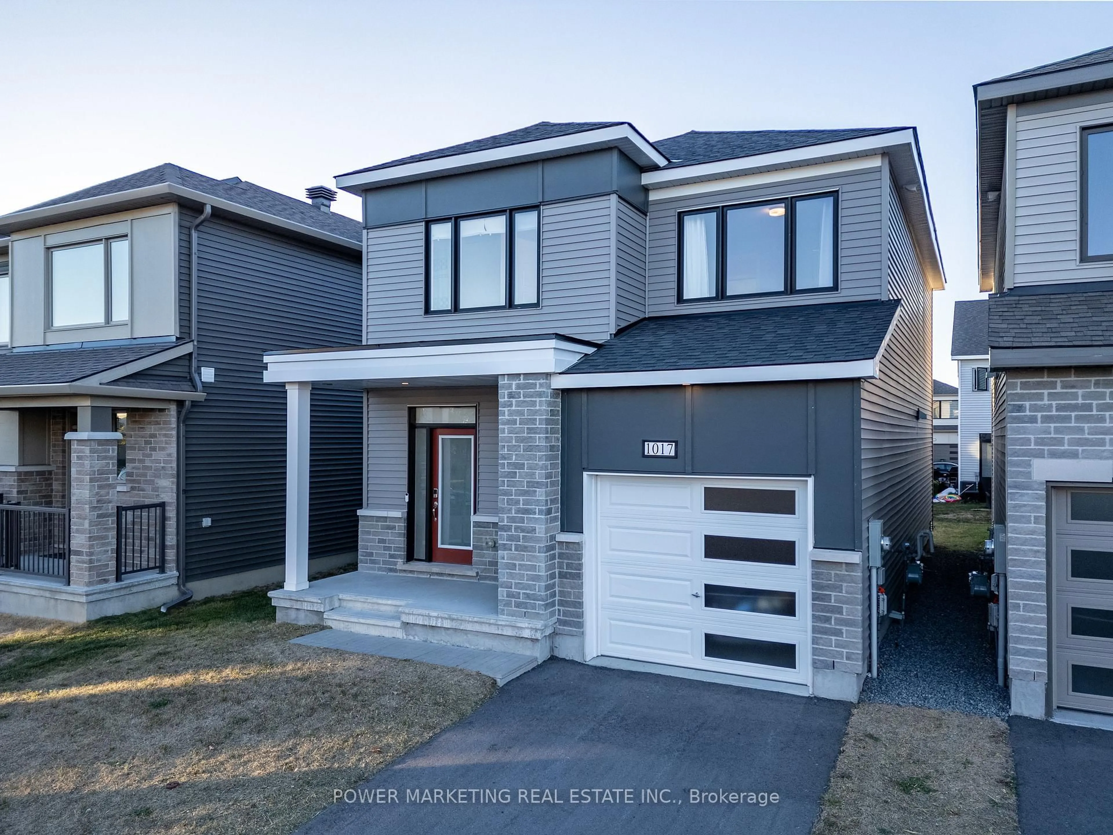 Home with brick exterior material, street for 1017 Curraglass Walk, Stittsville Ontario K2S 3A6