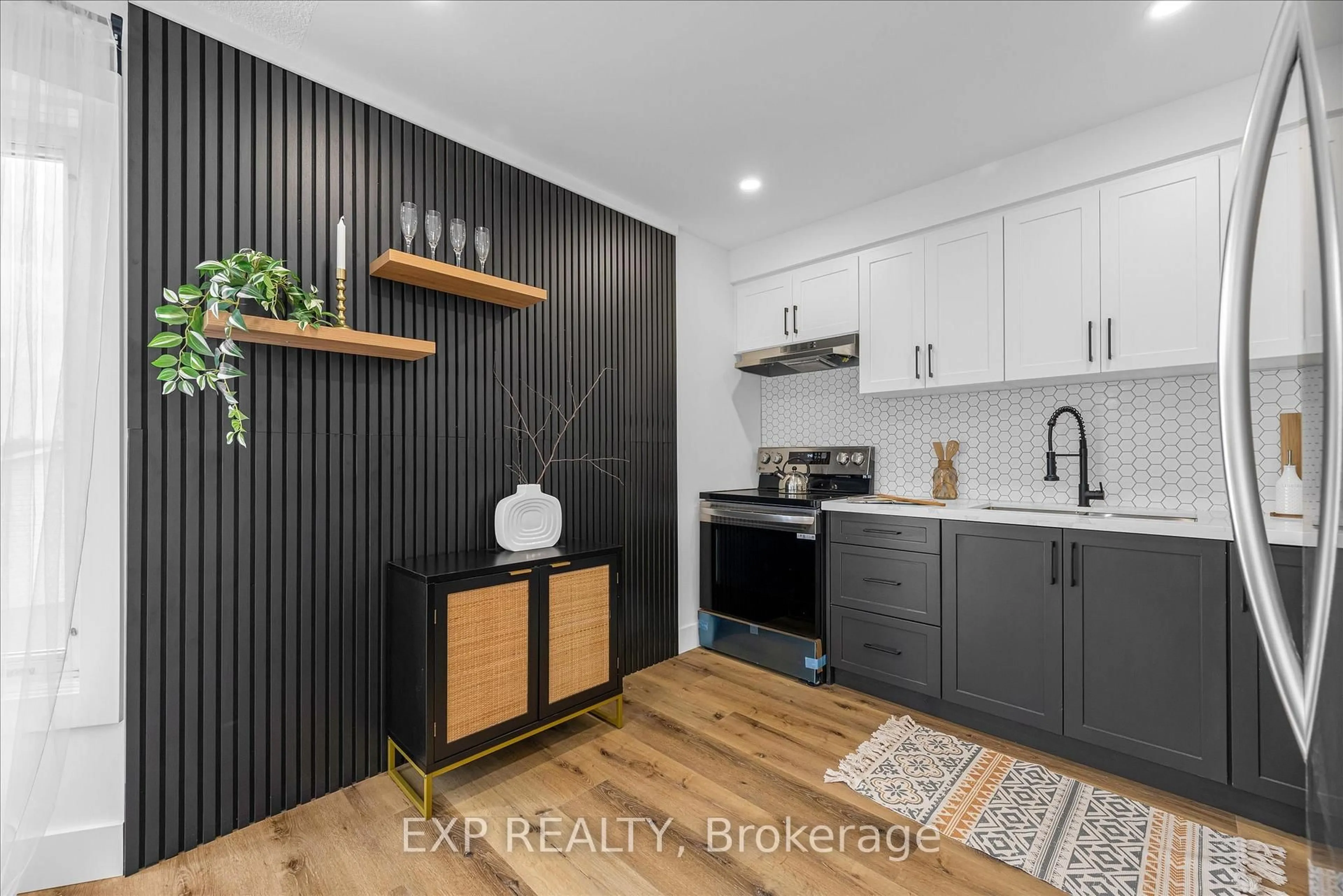 Open concept kitchen, wood/laminate floor for 1255 Upper Gage Ave #10, Hamilton Ontario L8W 3C7