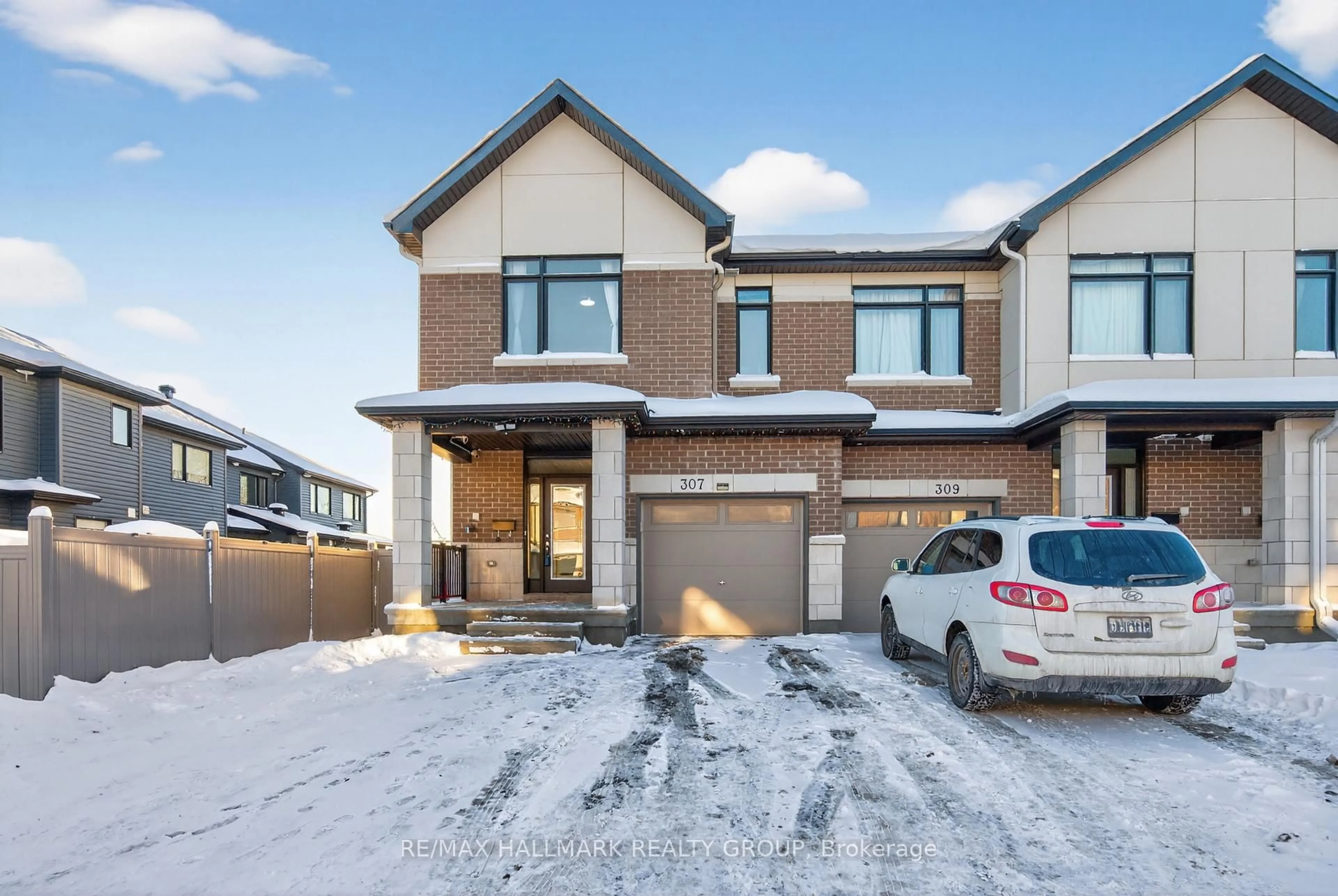 Home with brick exterior material, street for 307 Ibanez Walk, Ottawa Ontario K1T 0V8