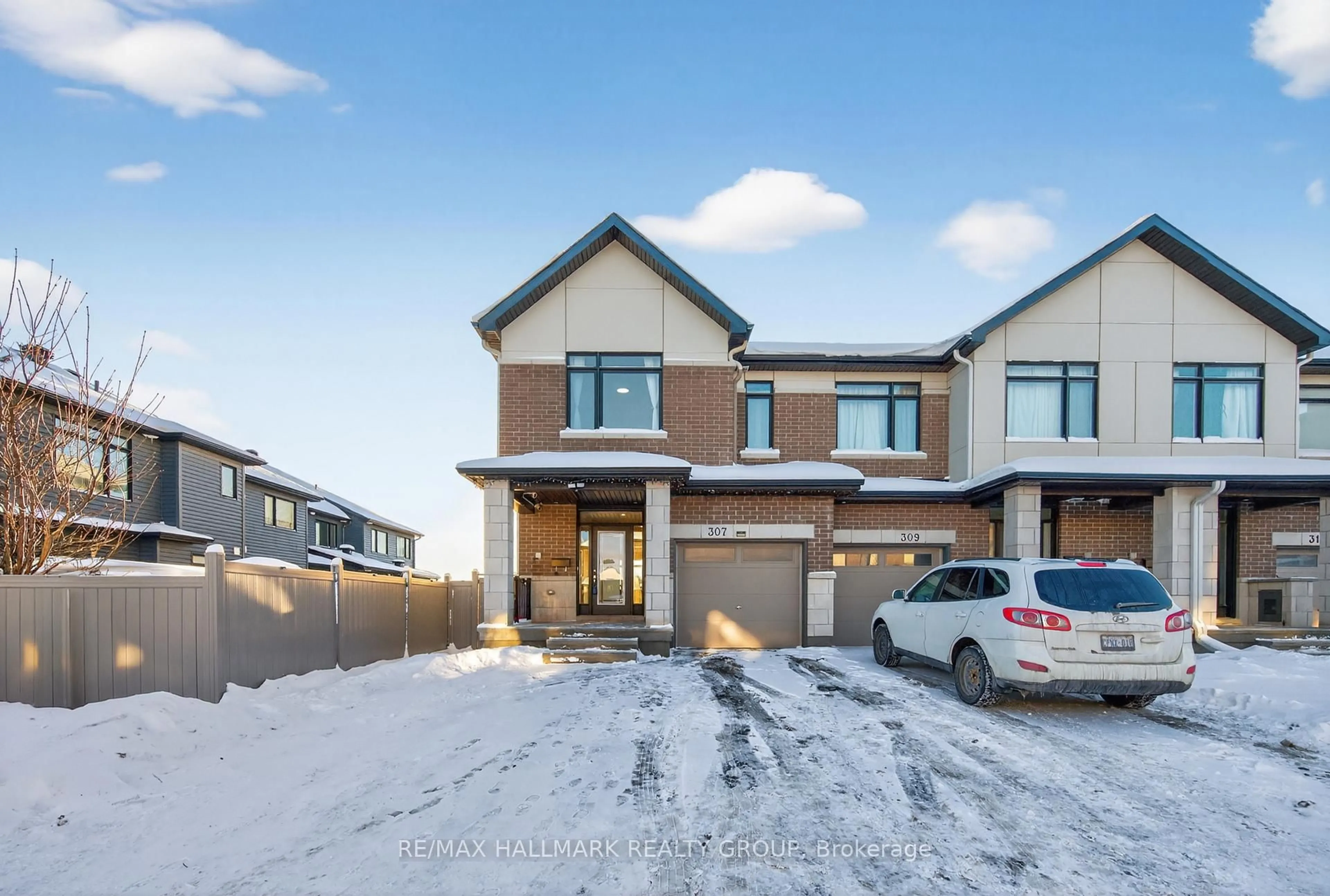 Home with brick exterior material, street for 307 Ibanez Walk, Ottawa Ontario K1T 0V8