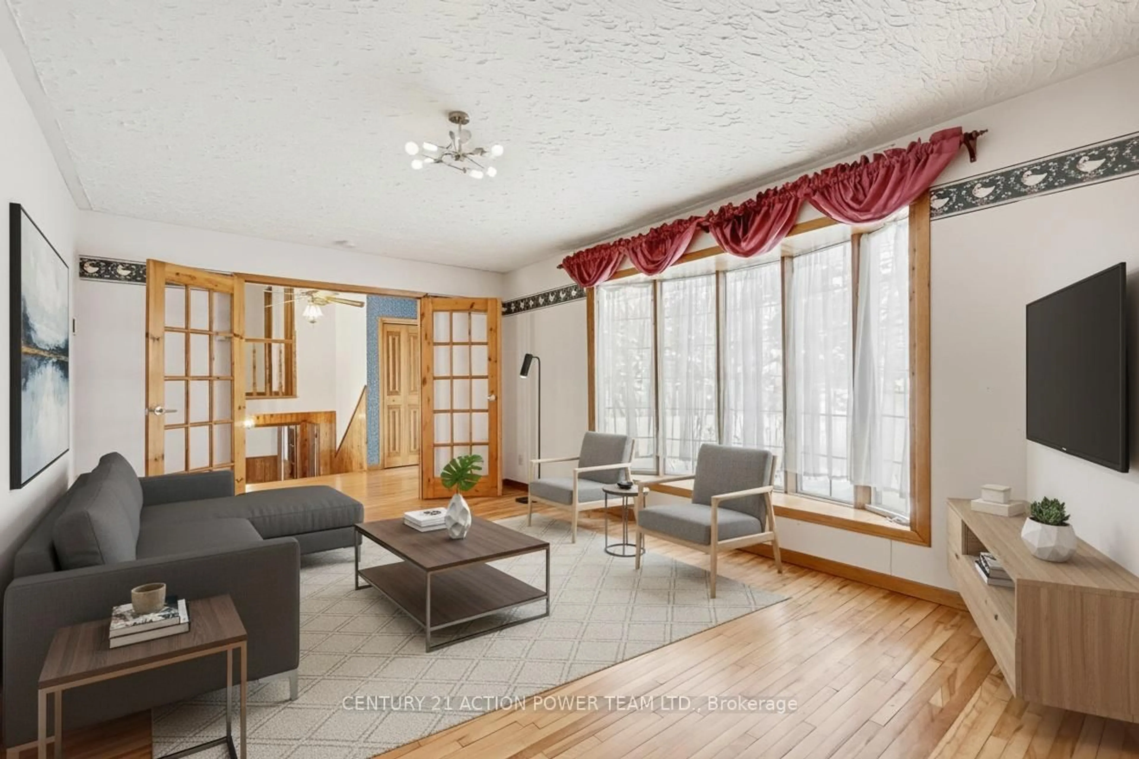 Living room with furniture, wood/laminate floor for 2968 Principale St, Alfred and Plantagenet Ontario K0A 3K0