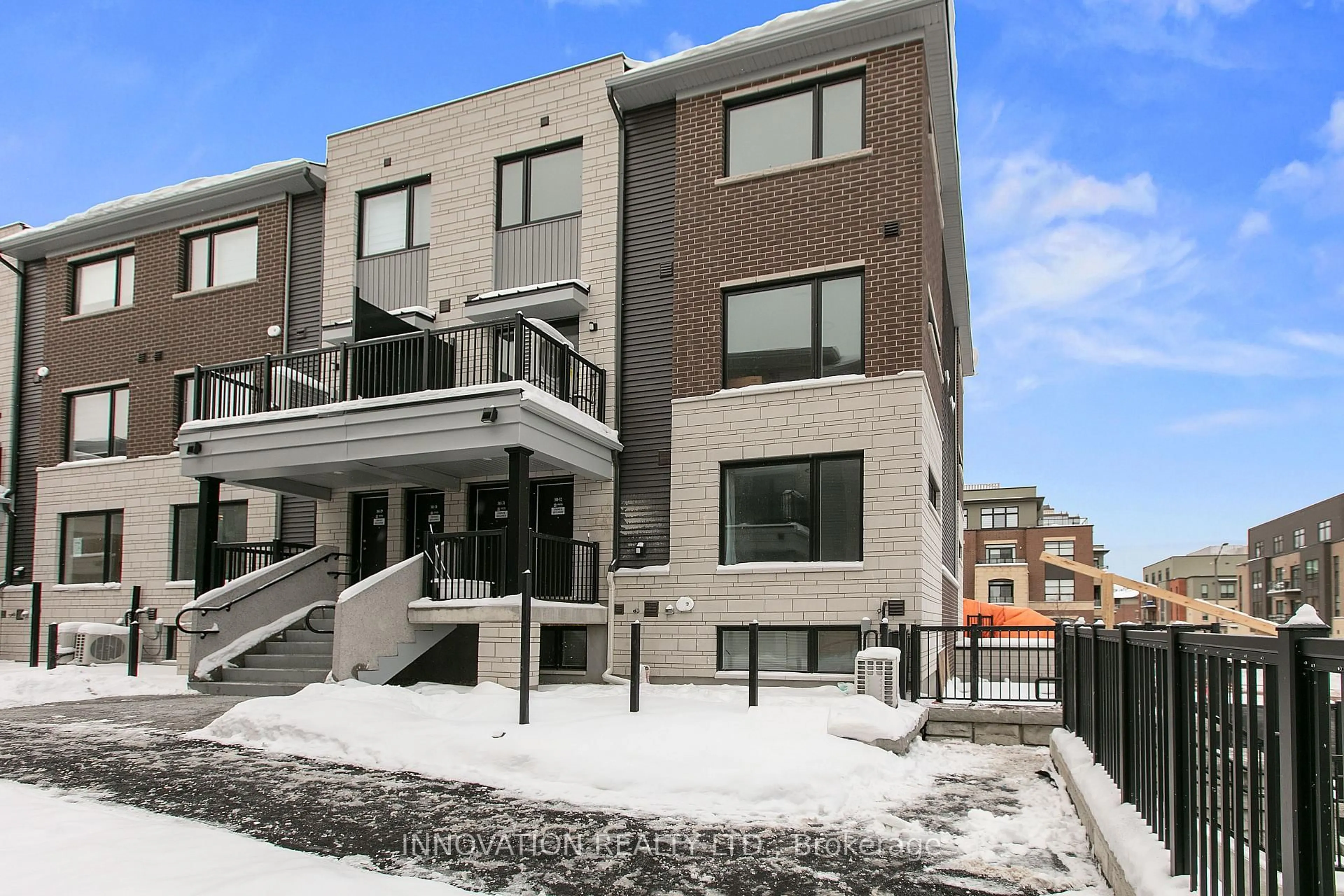 Home with brick exterior material, street for 301 GLENROY GILBERT Dr #32, Ottawa Ontario K2J 5W2