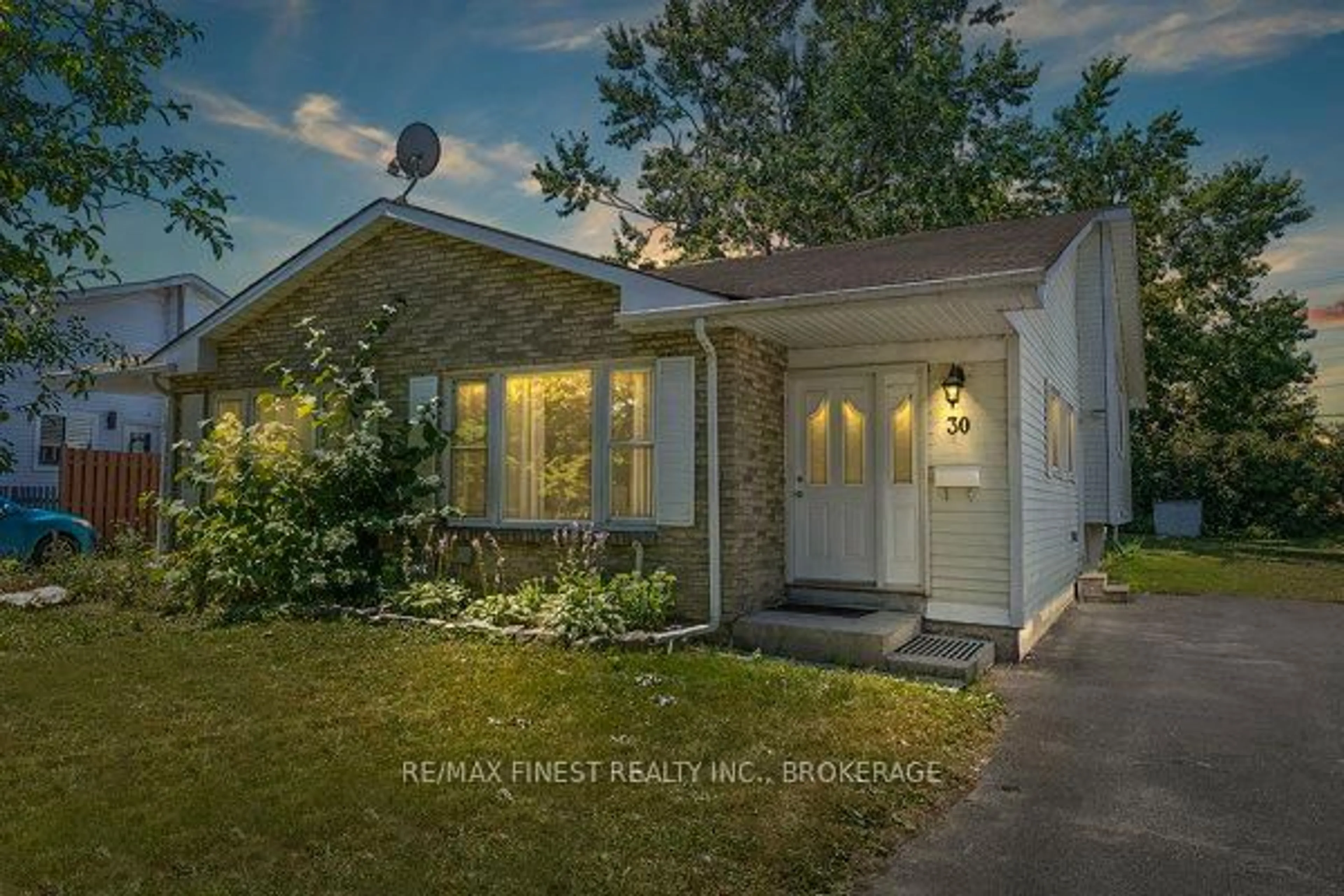 Home with vinyl exterior material, street for 30 Woodstone Cres, Kingston Ontario K7M 6K9