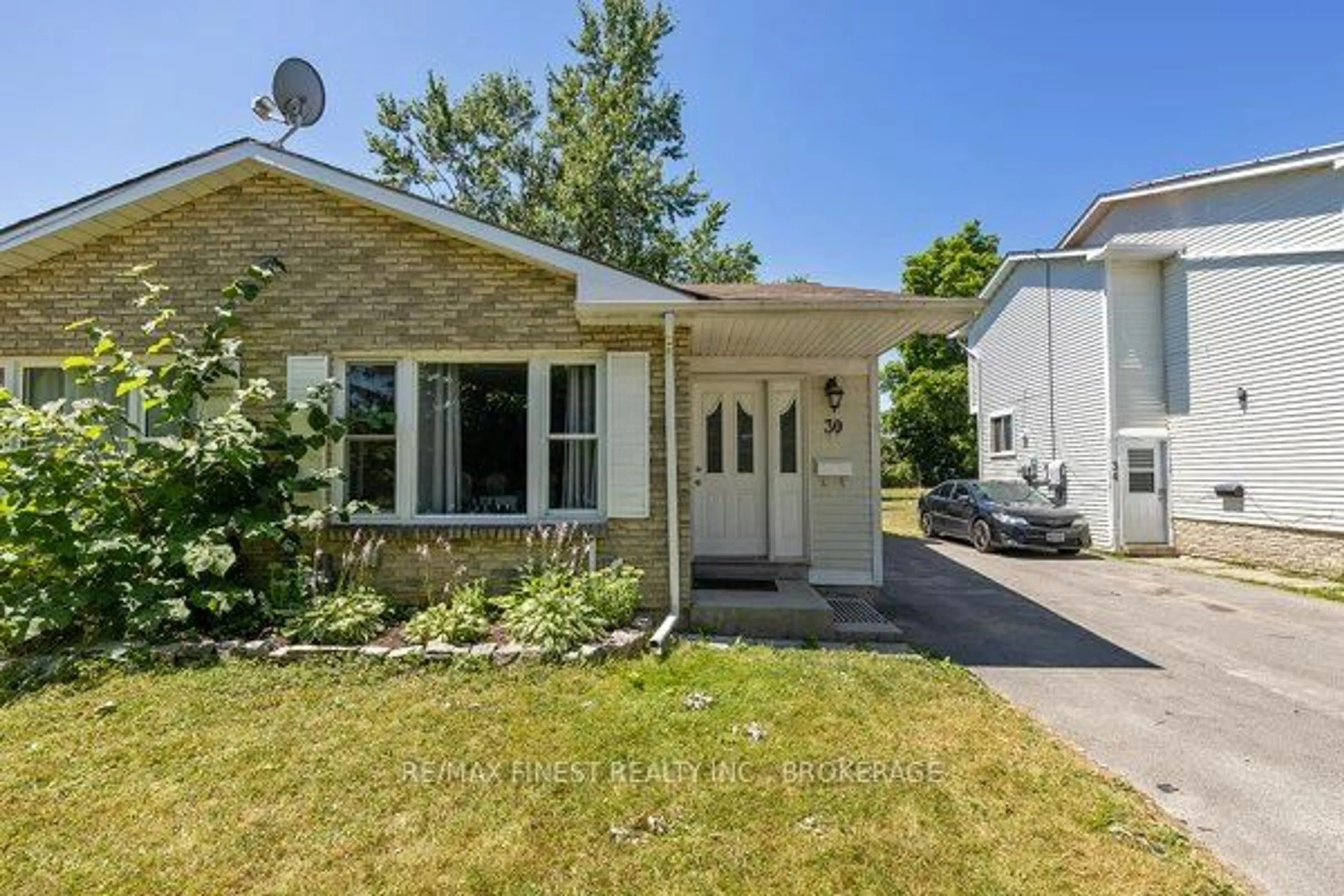 Home with vinyl exterior material, street for 30 Woodstone Cres, Kingston Ontario K7M 6K9