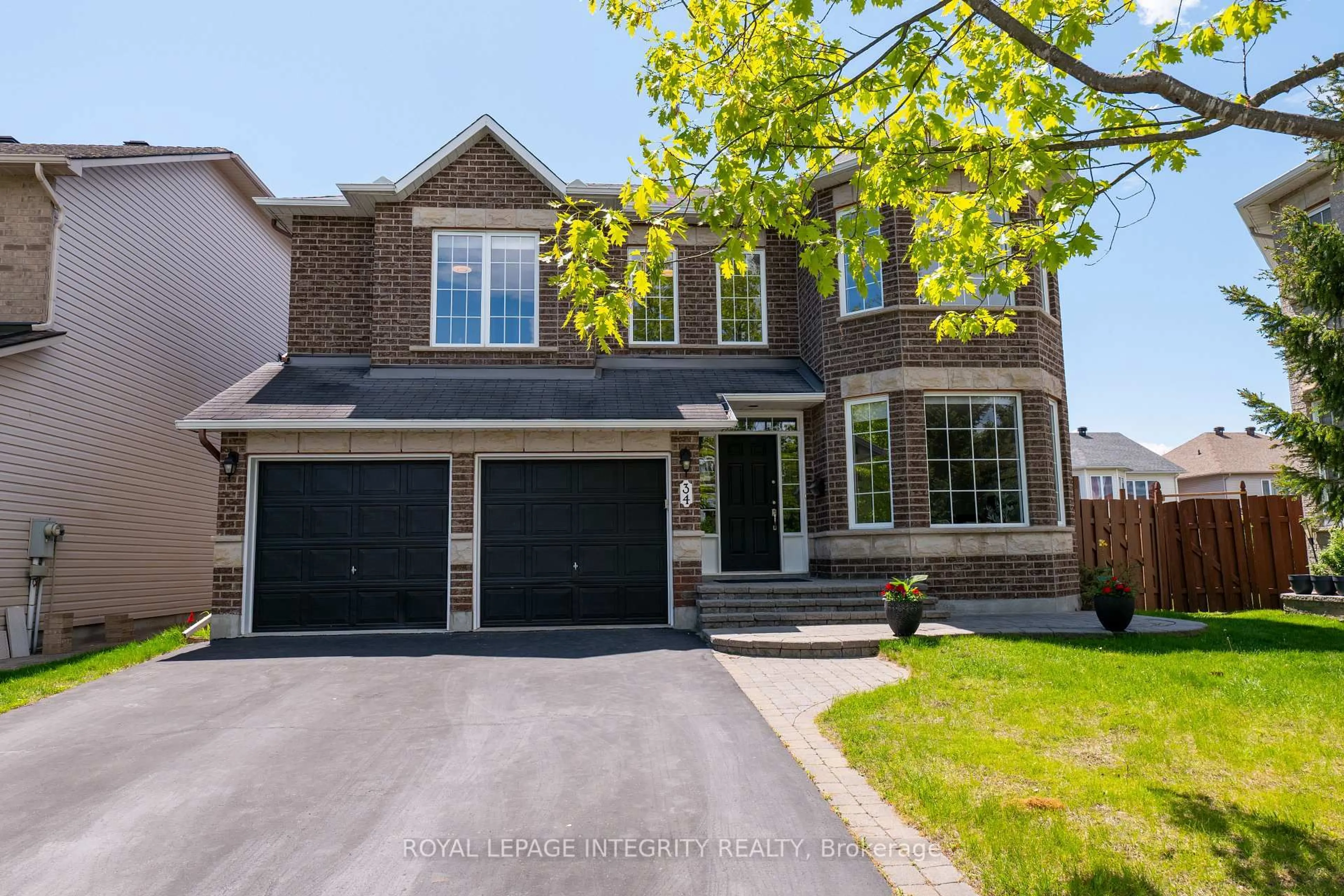 Home with brick exterior material, street for 34 Keighley Circ, Ottawa Ontario K2K 3H8