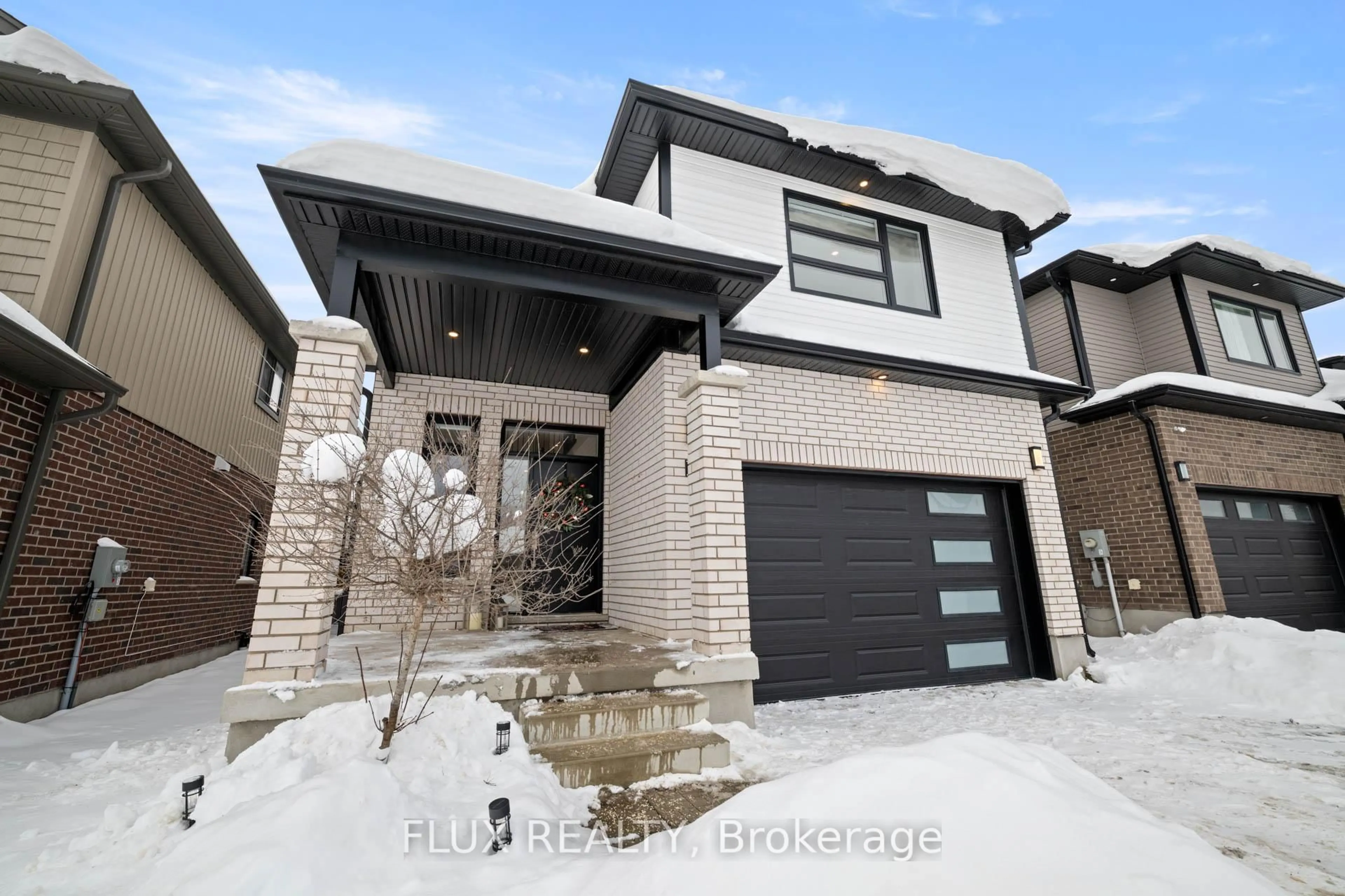 Home with brick exterior material, street for 215 Timber Trail Rd, Waterloo Ontario N3B 0C5