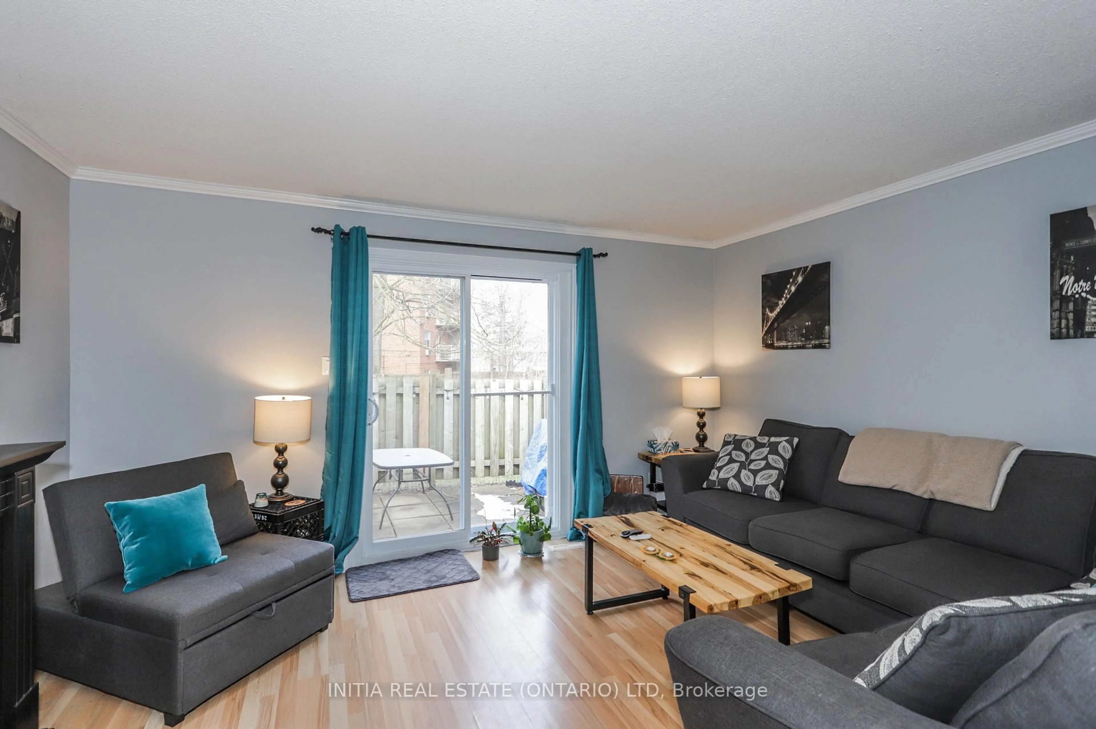 Living room with furniture, wood/laminate floor for 1247 Huron St #91, London East Ontario N5Y 4X7