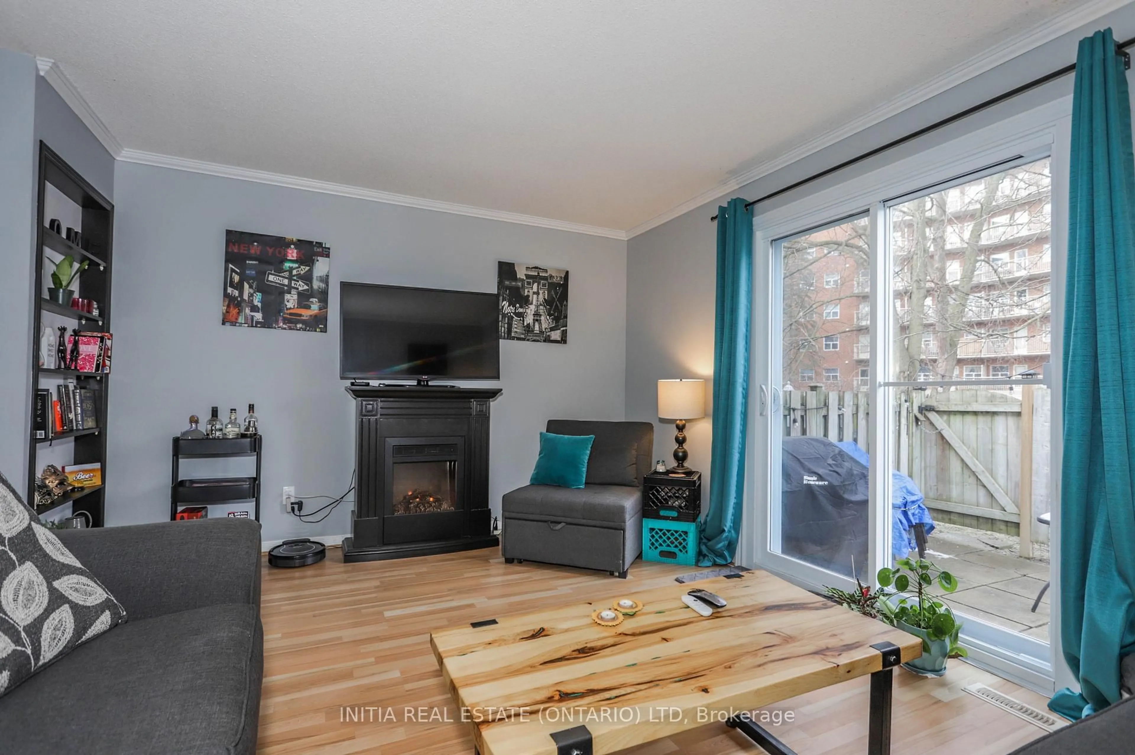 Living room with furniture, wood/laminate floor for 1247 Huron St #91, London East Ontario N5Y 4X7