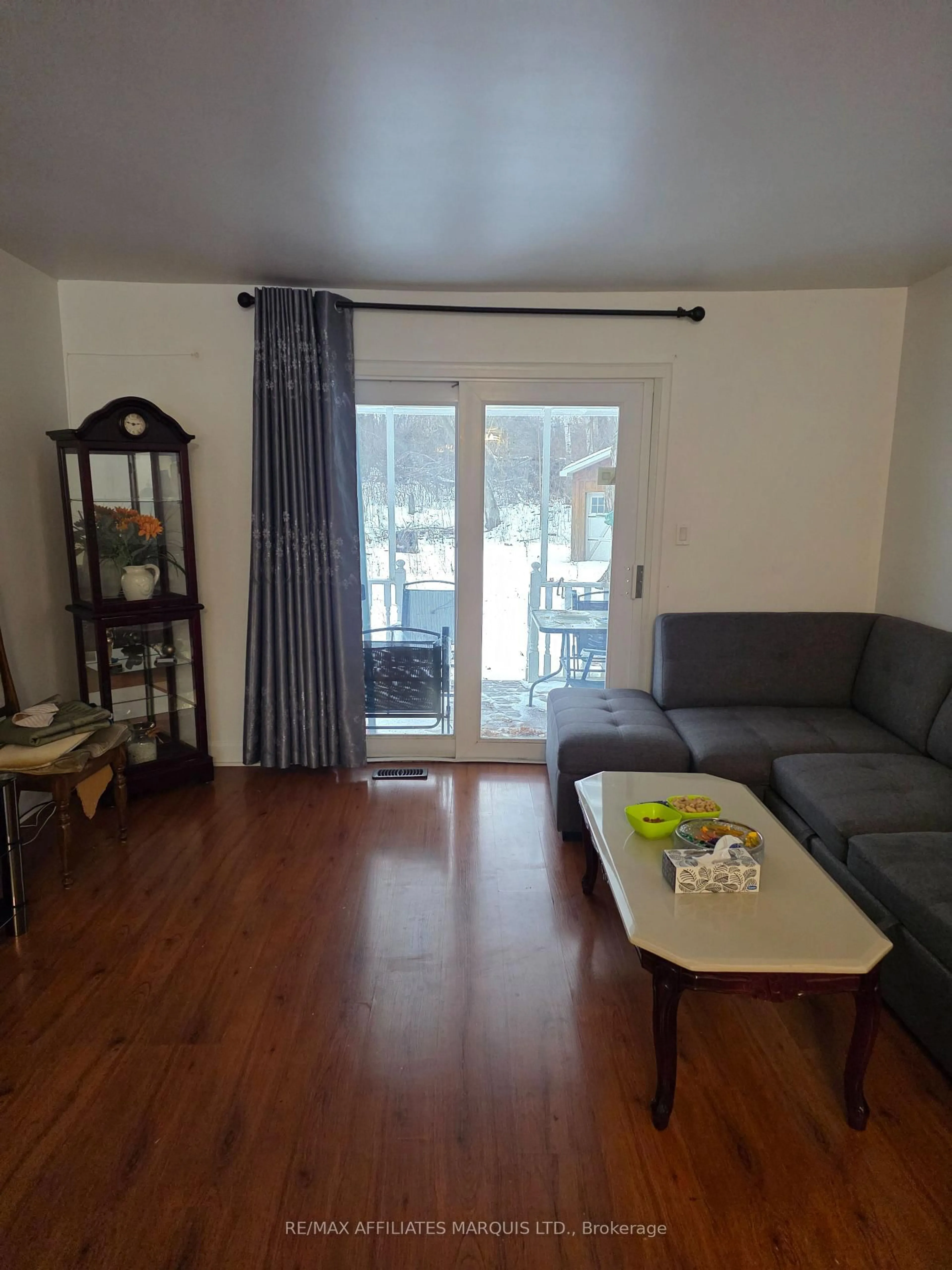 Living room with furniture, wood/laminate floor for 3233 Richmond Dr, Cornwall Ontario K0C 1P0