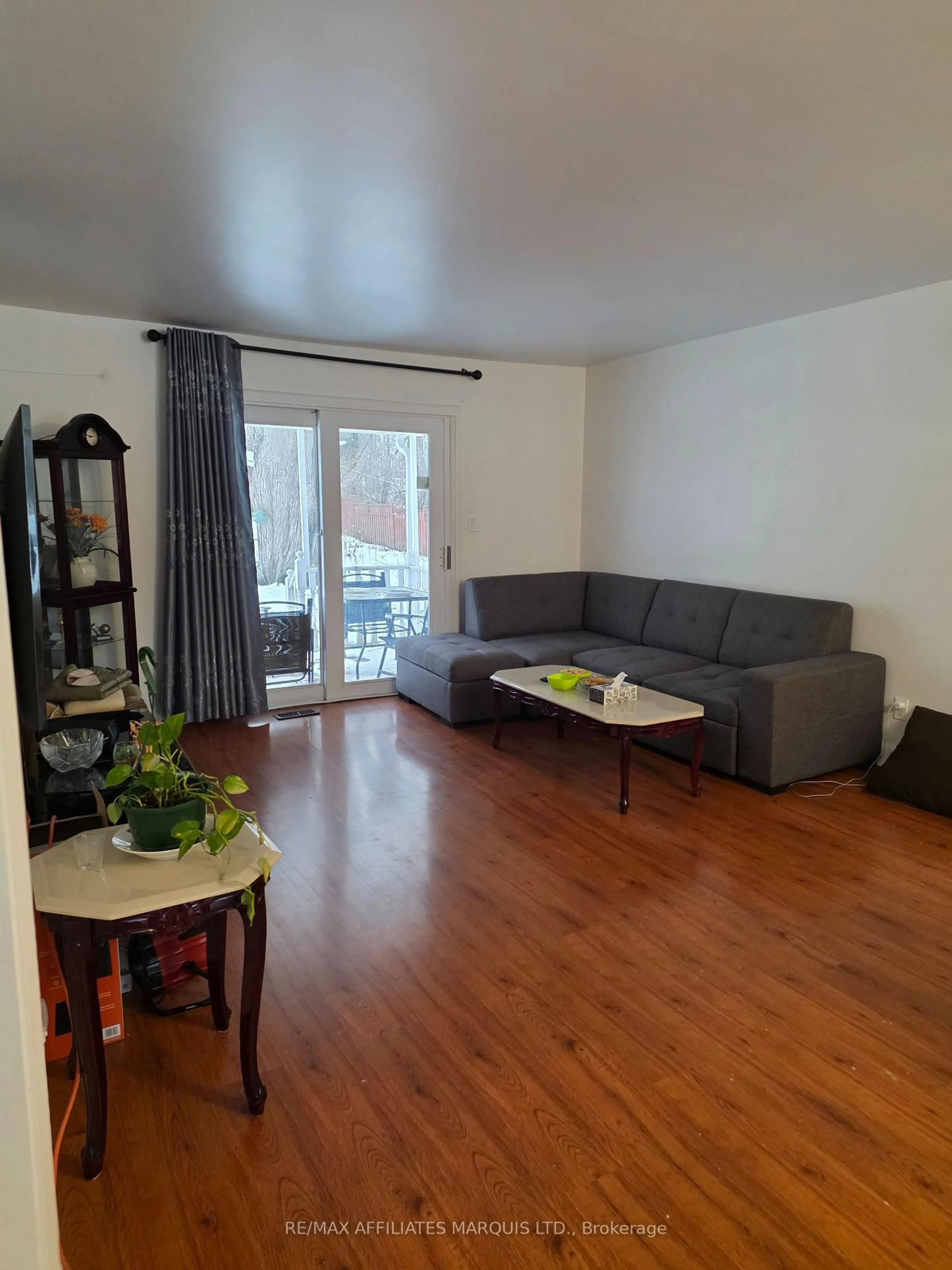 Living room with furniture, wood/laminate floor for 3233 Richmond Dr, Cornwall Ontario K0C 1P0