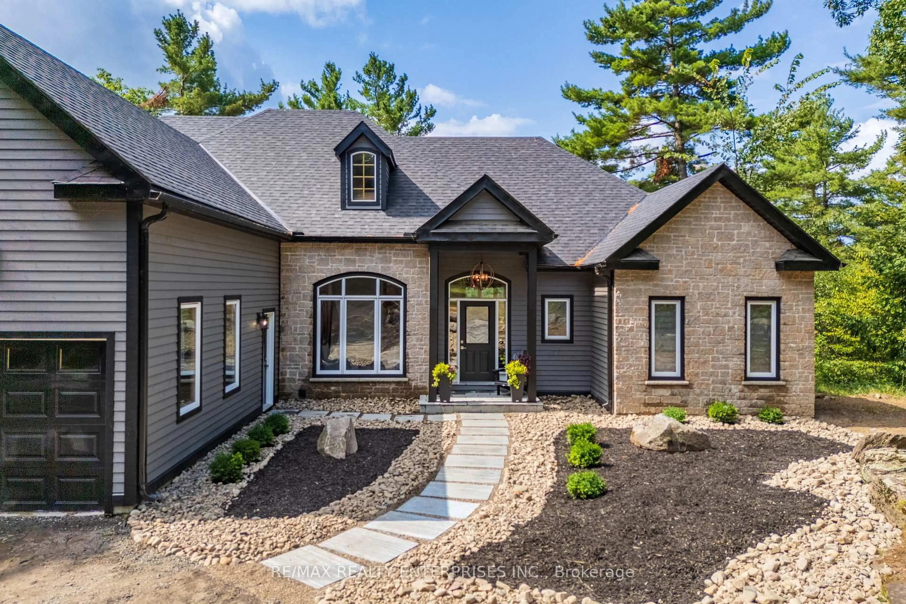 Home with brick exterior material, street for 49 Estates Dr, Muskoka Lakes Ontario P0B 1J0