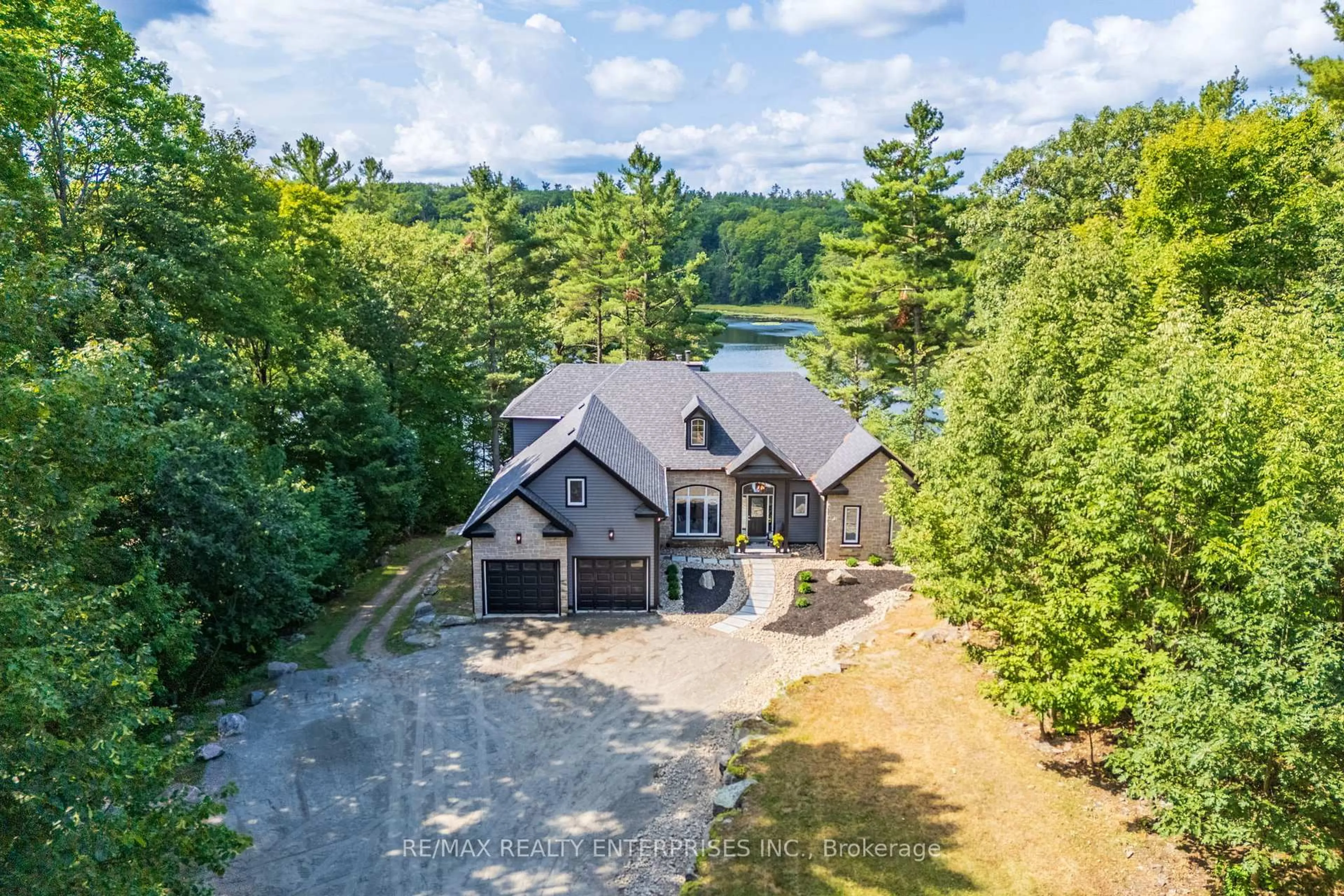 A pic from outside/outdoor area/front of a property/back of a property/a pic from drone, water/lake/river/ocean view for 49 Estates Dr, Muskoka Lakes Ontario P0B 1J0