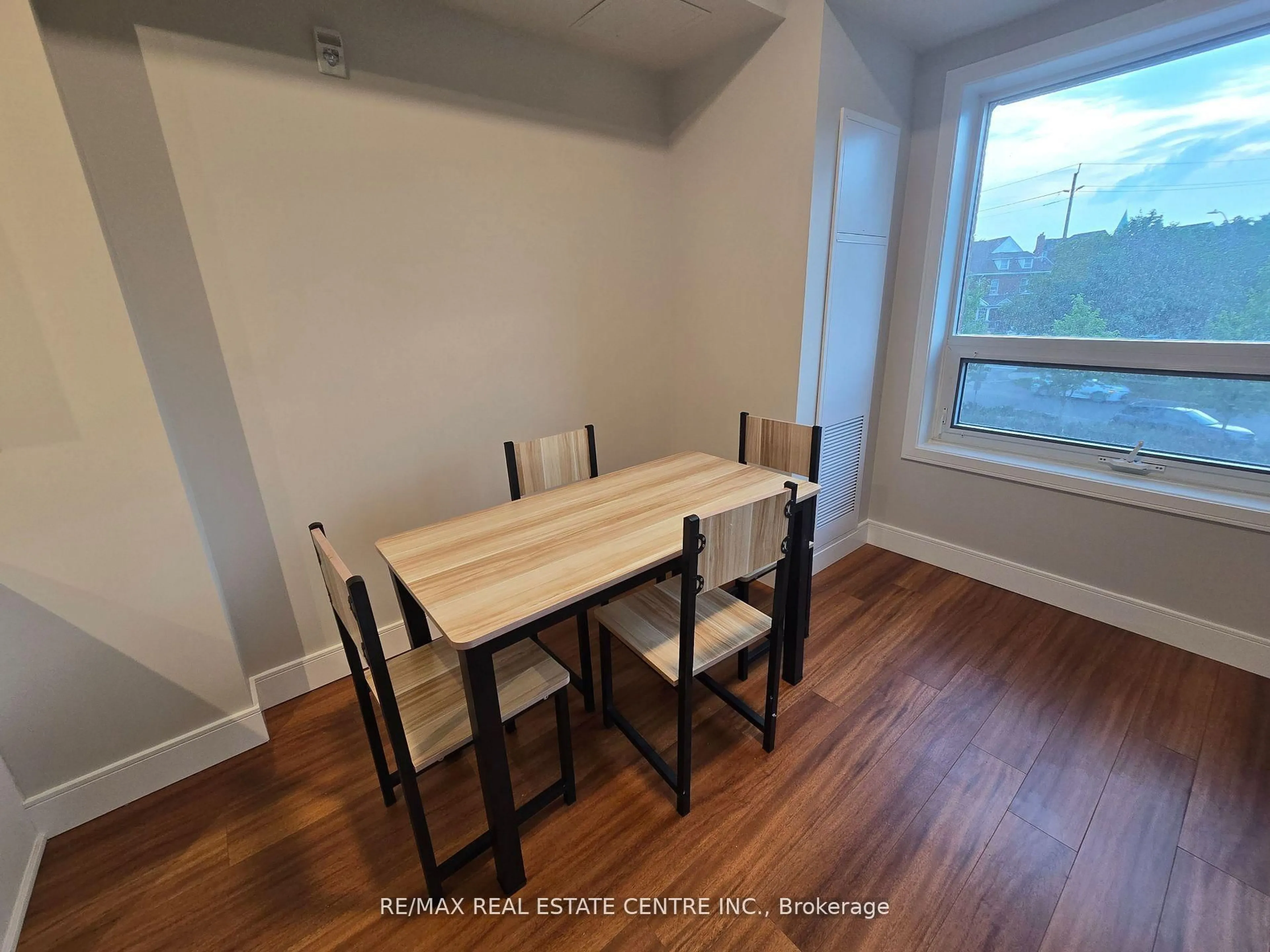 Dining room, wood/laminate floor for 1 Wellington St #207, Brantford Ontario N3T 2L3