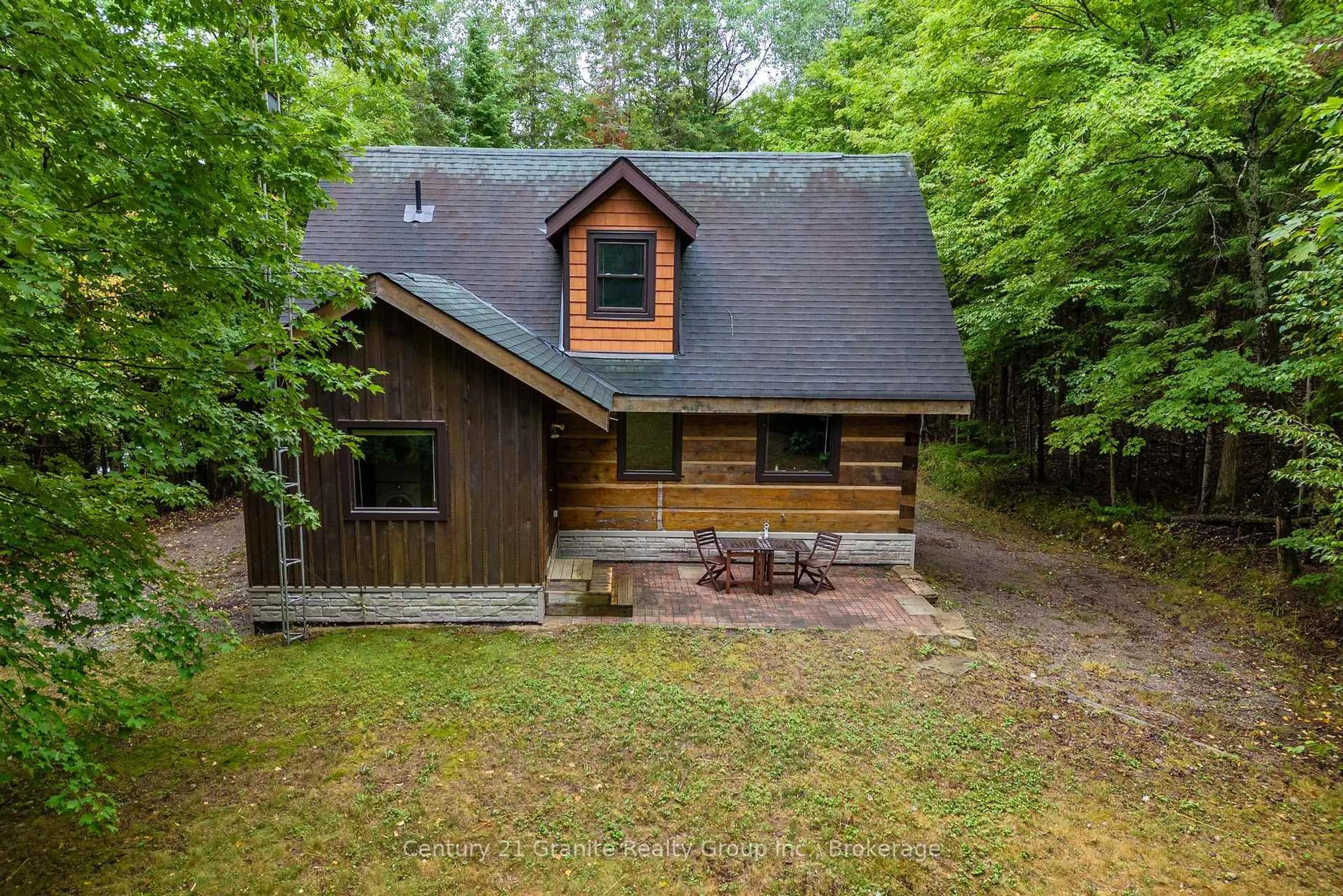 A pic from outside/outdoor area/front of a property/back of a property/a pic from drone, unknown for 19221 Highway 118, Highlands East Ontario K0M 1S0