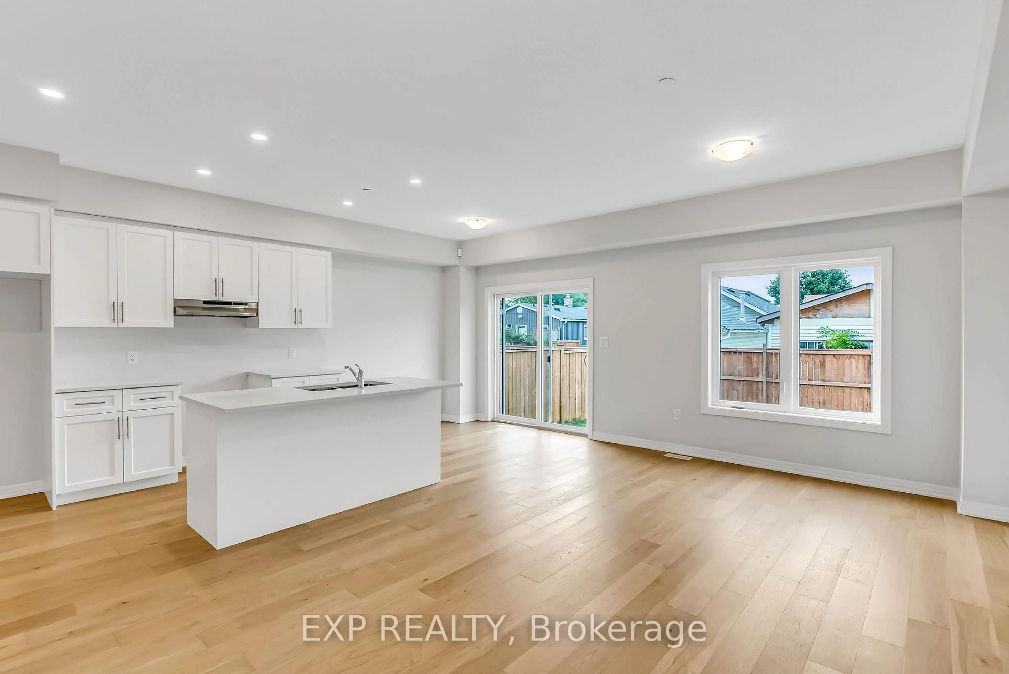 Open concept kitchen, wood/laminate floor for 16 Bromley Dr, St. Catharines Ontario L2M 1R1