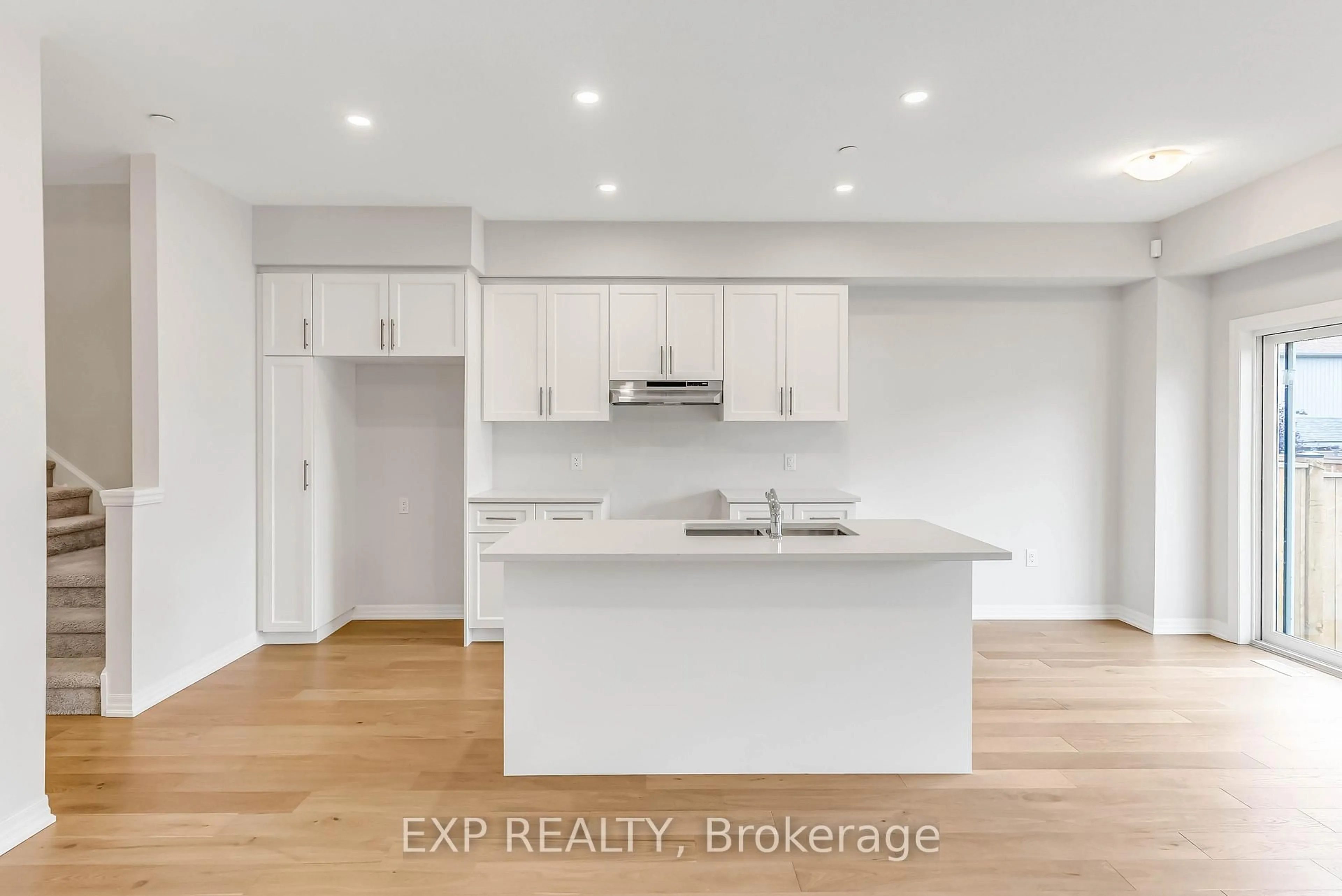 Open concept kitchen, wood/laminate floor for 16 Bromley Dr, St. Catharines Ontario L2M 1R1