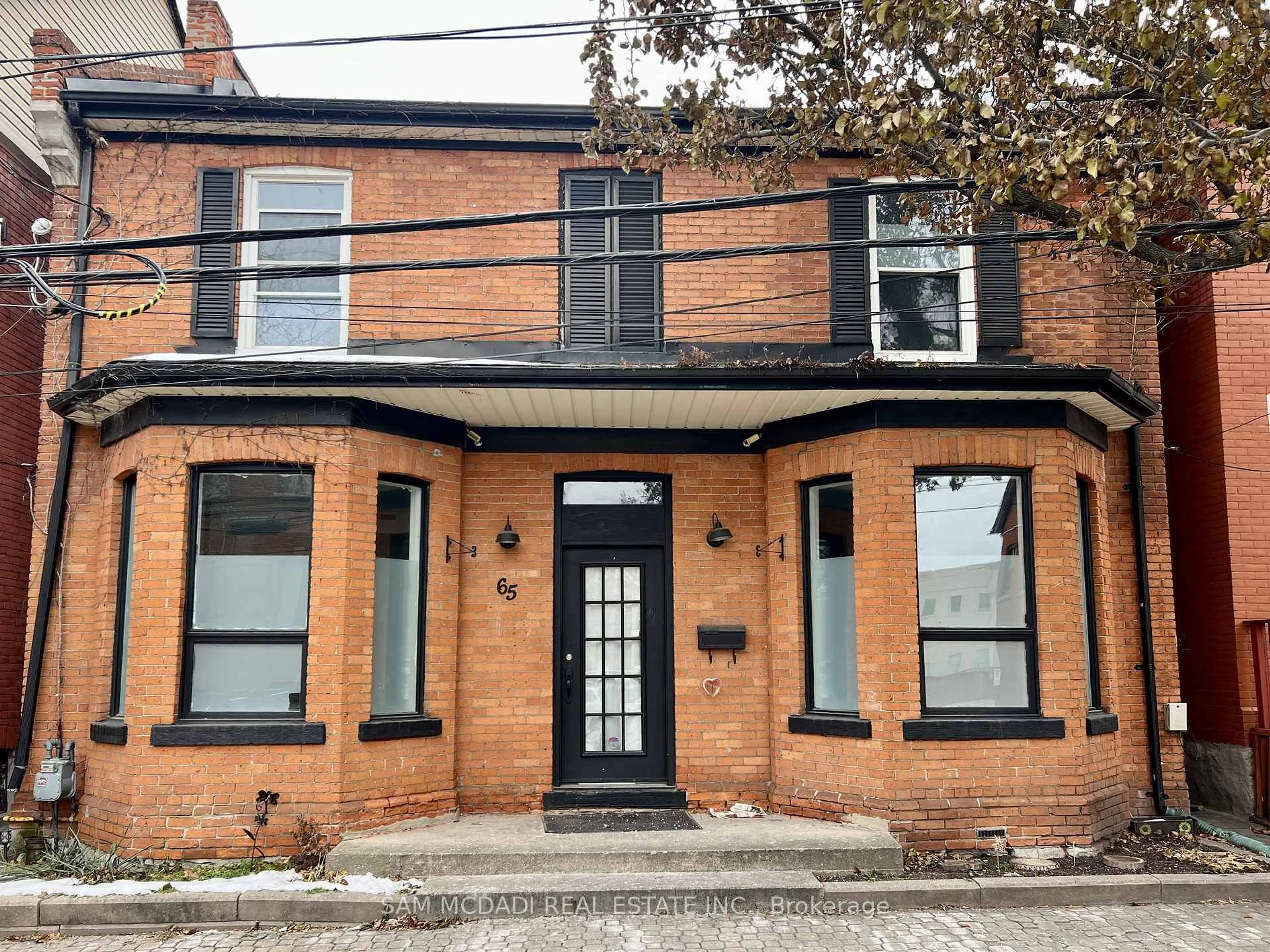 Home with brick exterior material, street for 65 Walnut St, Hamilton Ontario L8N 2L2
