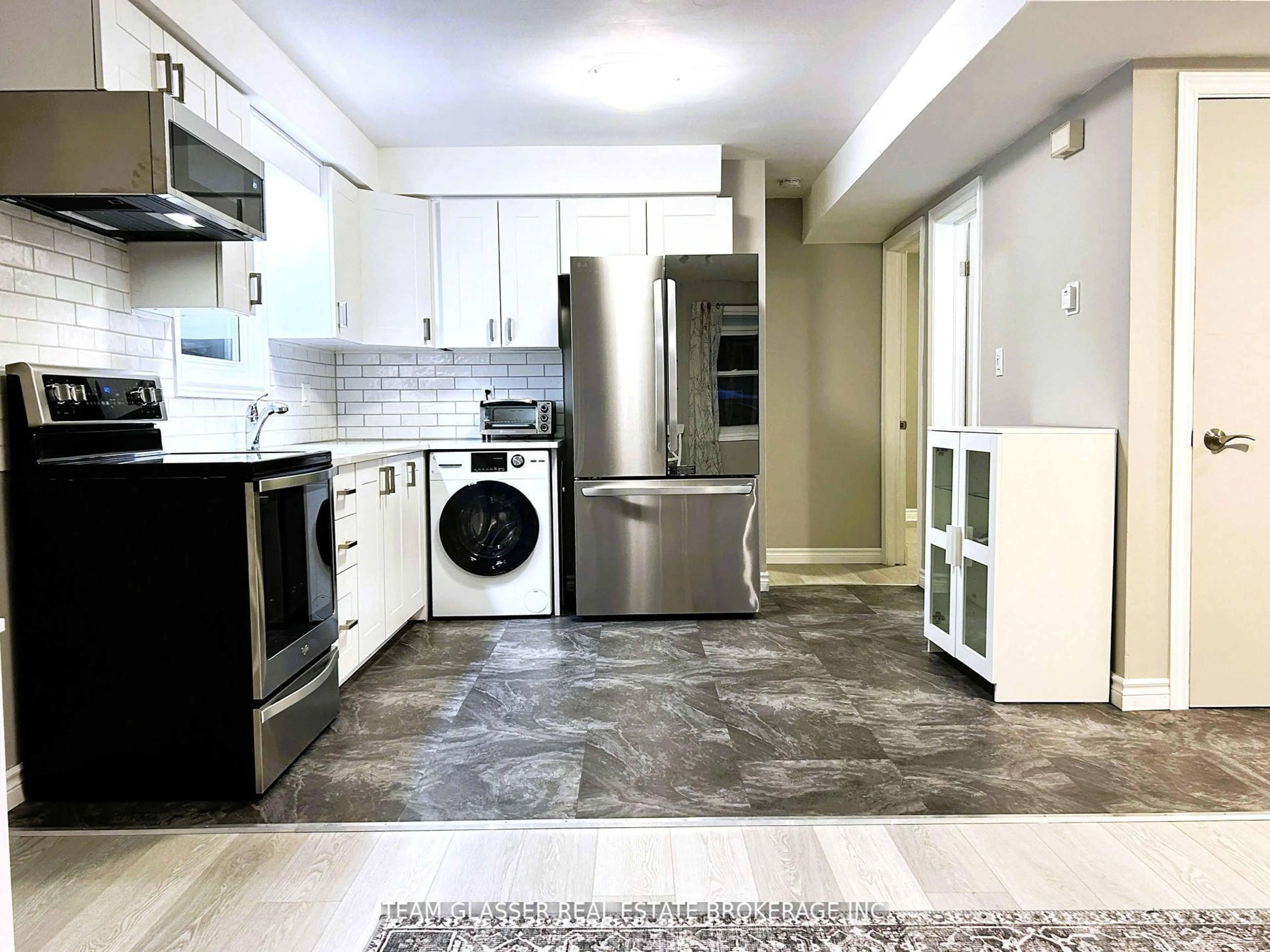 Kitchen with laundary machines, ceramic/tile floor for 630 Victoria St, London East Ontario N5Y 4C1