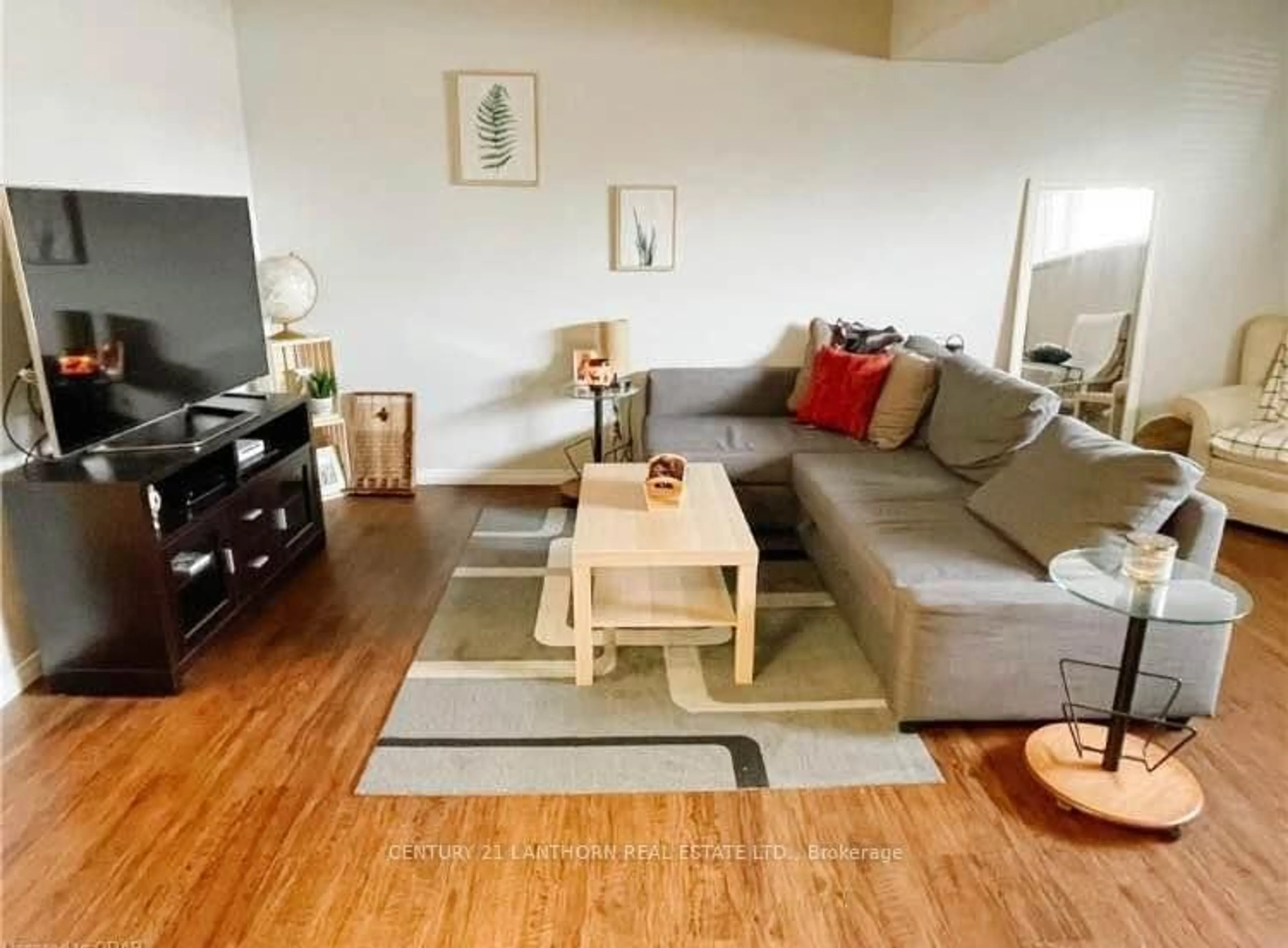 Living room with furniture, wood/laminate floor for 22 Water St, Quinte West Ontario K8V 4L9