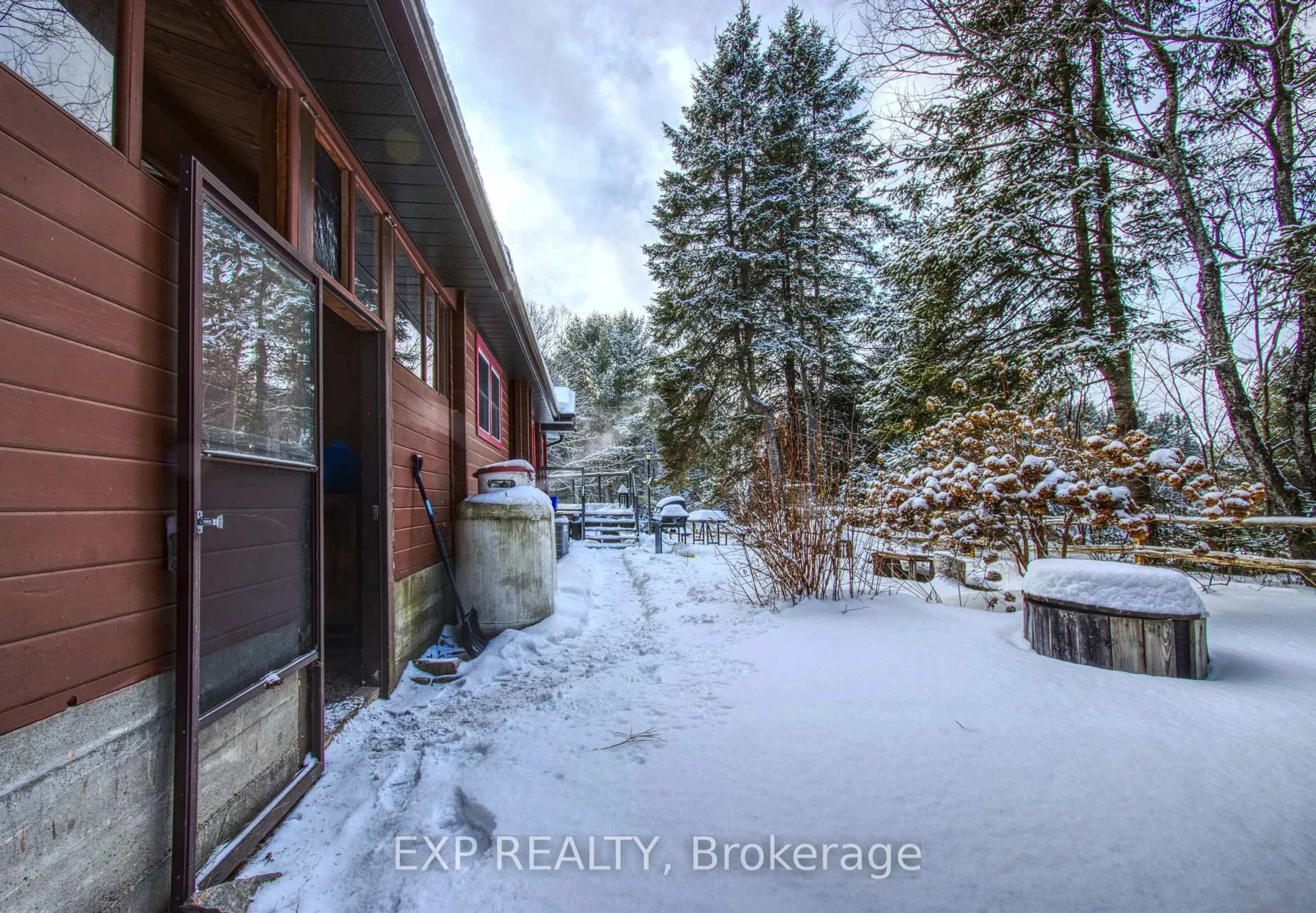 A pic from outside/outdoor area/front of a property/back of a property/a pic from drone, unknown for 27 Groeger Rd, Huntsville Ontario P1H 2J4