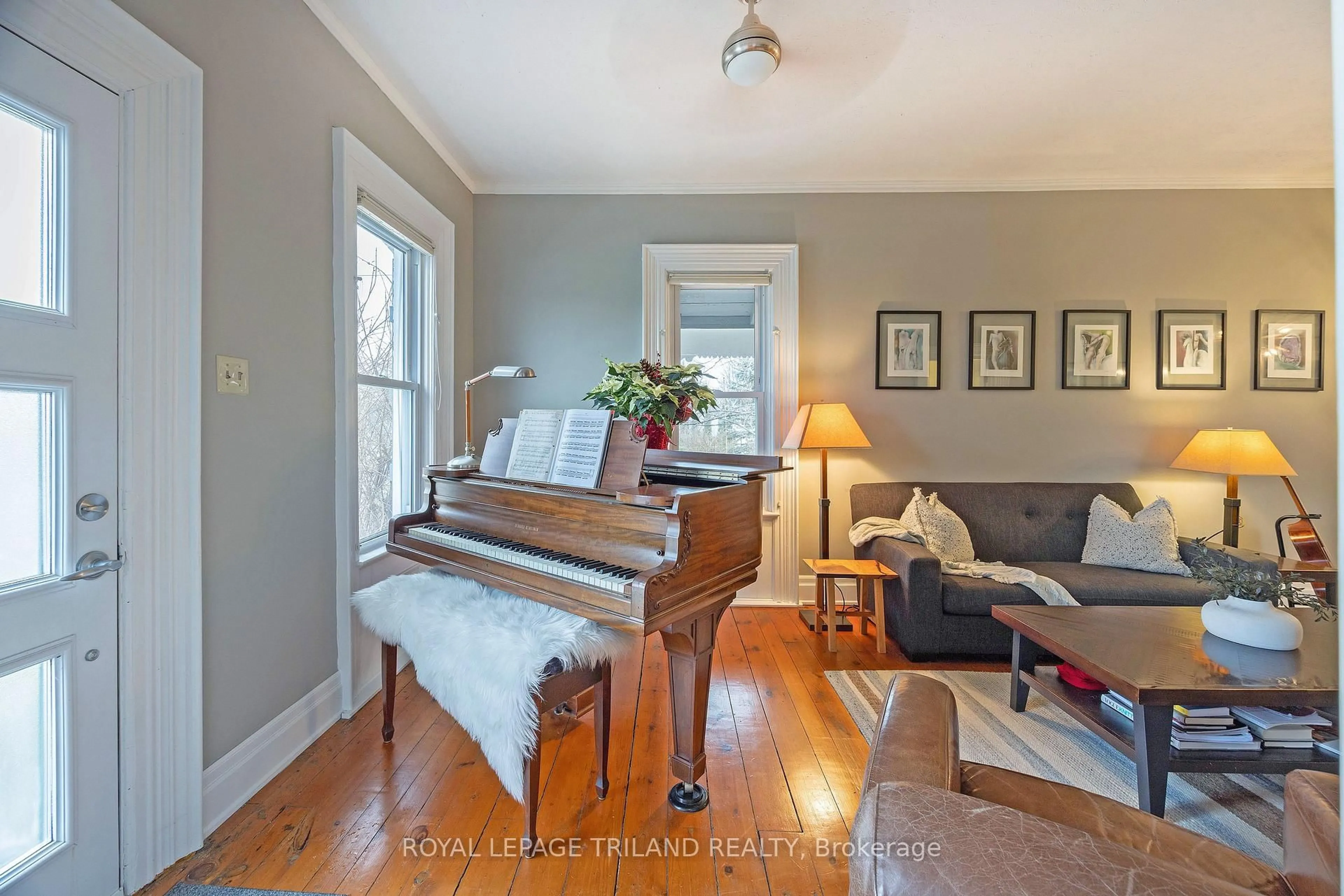 Living room with furniture, wood/laminate floor for 9855 John St, Southwold Ontario N0L 2E0