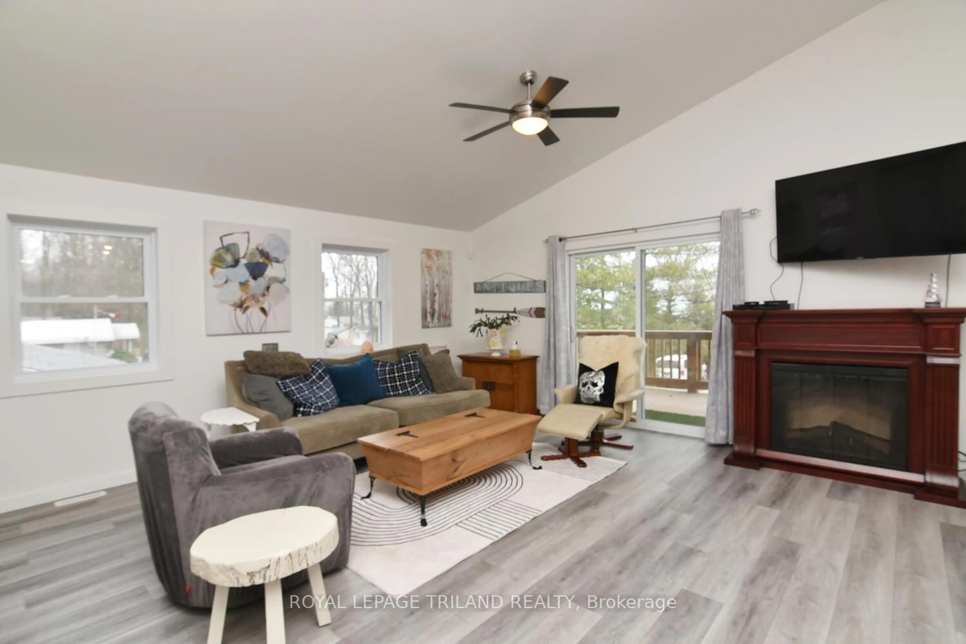 Living room with furniture, wood/laminate floor for 9904 LAKE Rd, Lambton Shores Ontario N0N 1J1